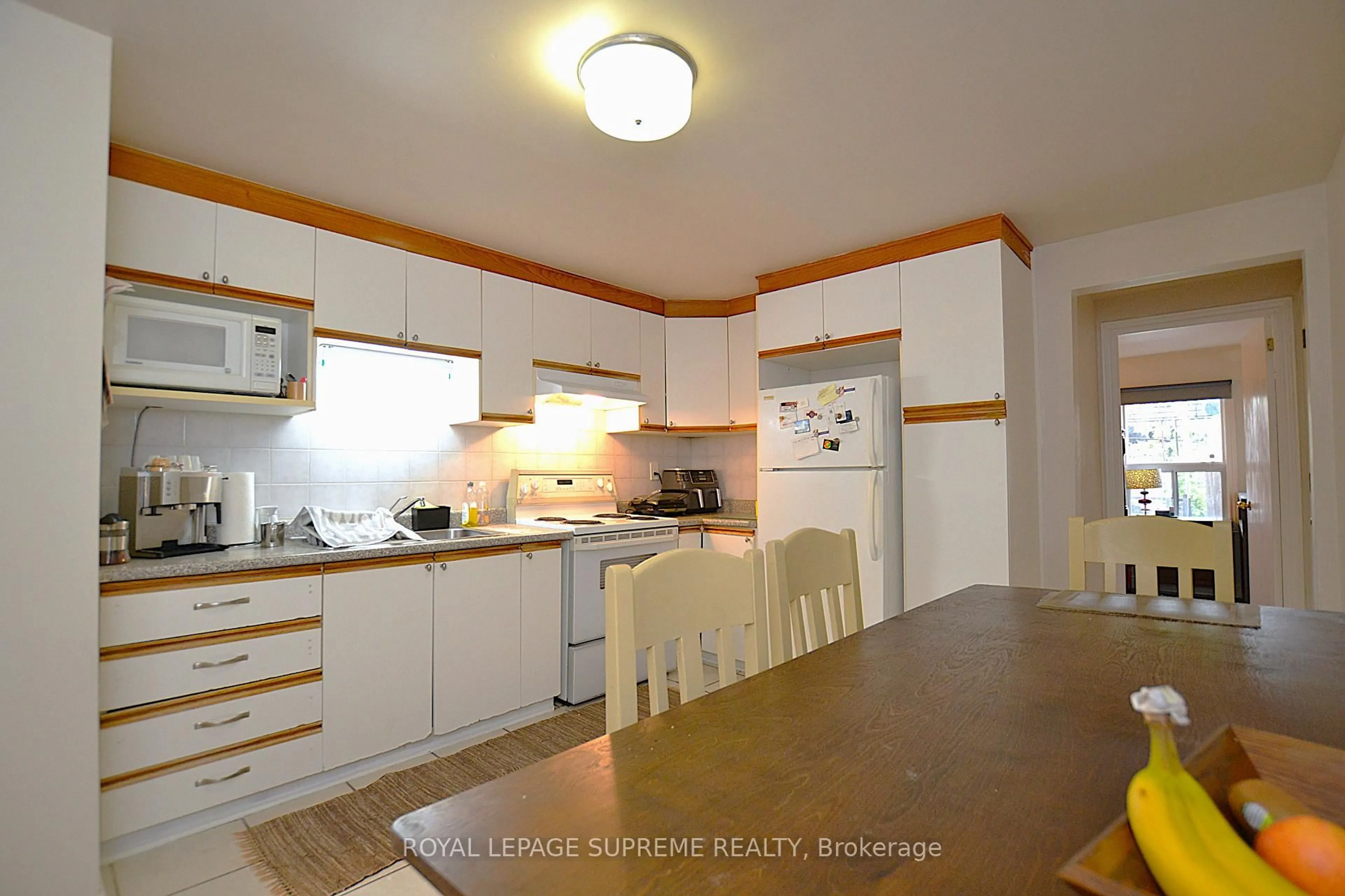 Standard kitchen, wood/laminate floor for 4 Chandos Ave, Toronto Ontario M6H 2E5