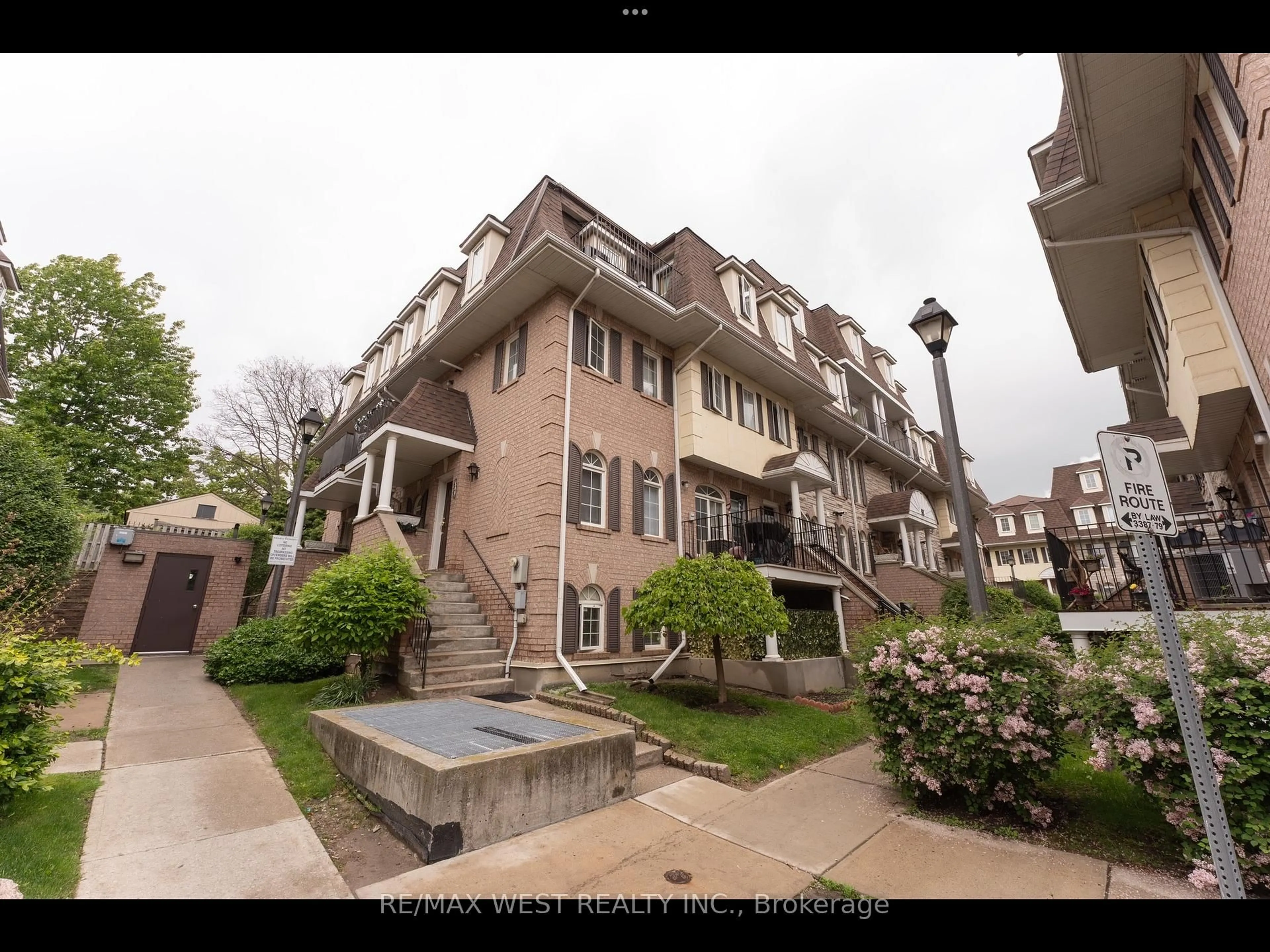 A pic from outside/outdoor area/front of a property/back of a property/a pic from drone, unknown for 52 Sidney Belsey Cres #104, Toronto Ontario M6M 5J1