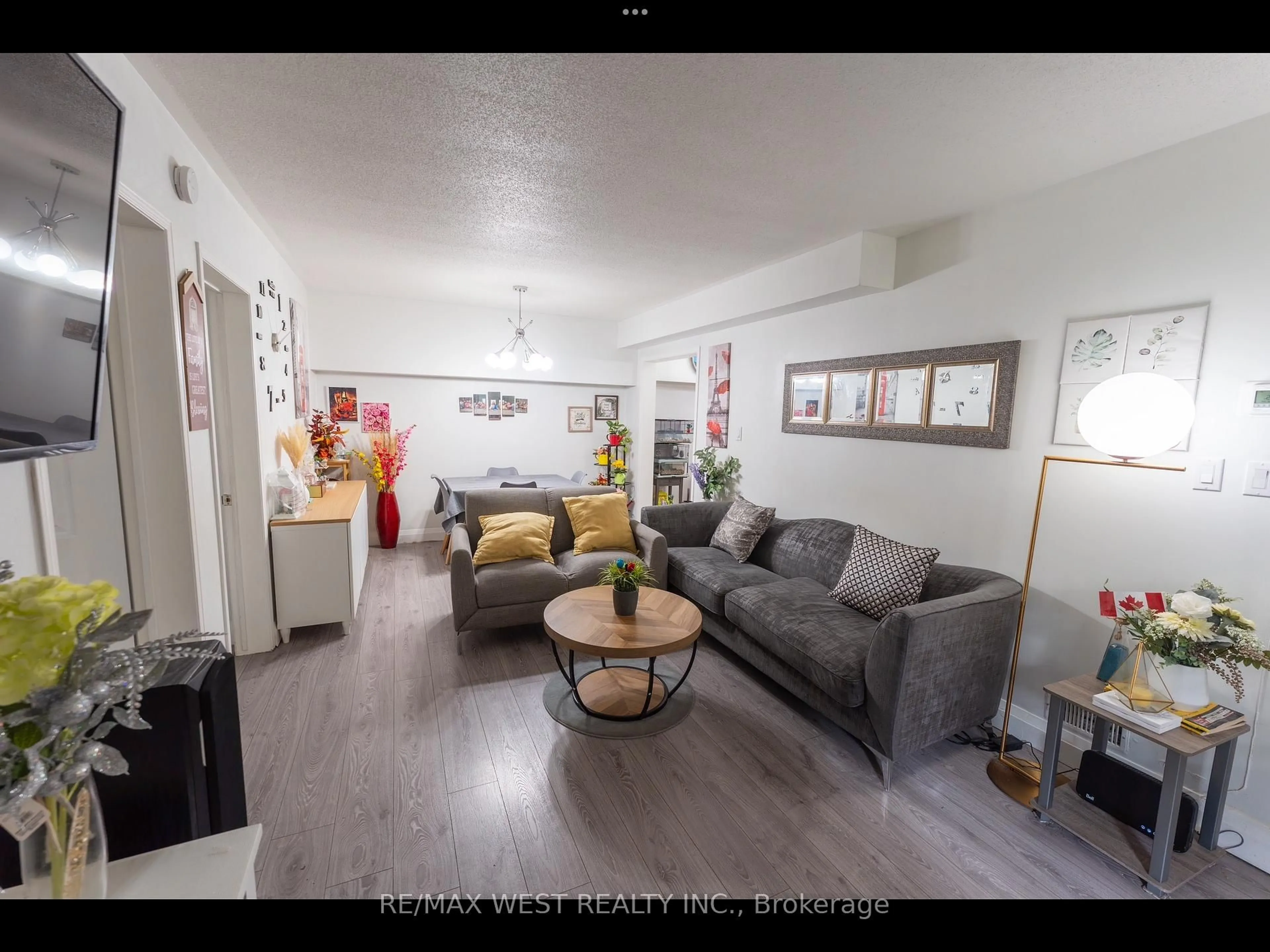 Living room with furniture, unknown for 52 Sidney Belsey Cres #104, Toronto Ontario M6M 5J1