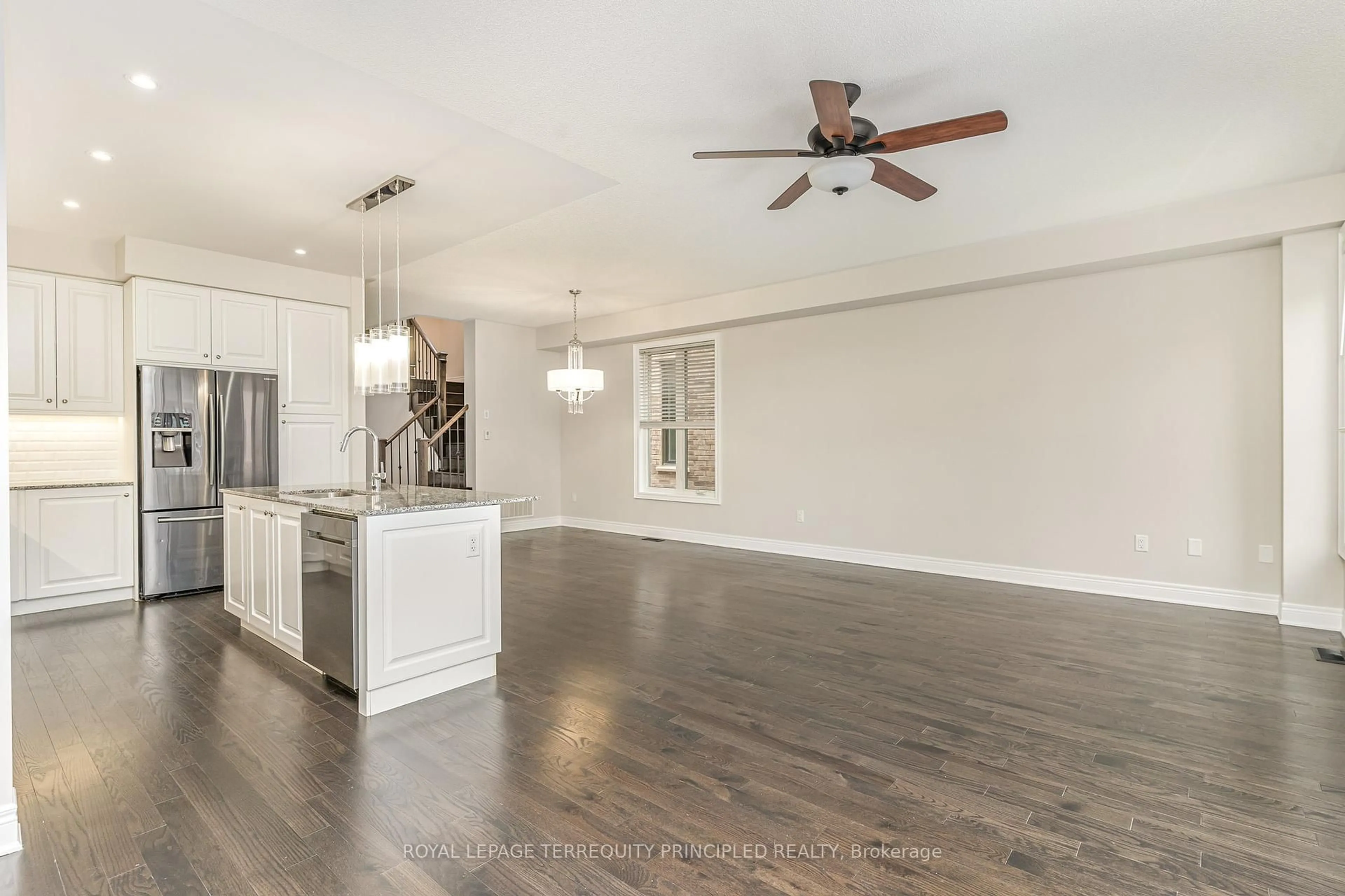 Open concept kitchen, wood/laminate floor for 1135 Hamman Way, Milton Ontario L9E 1K2