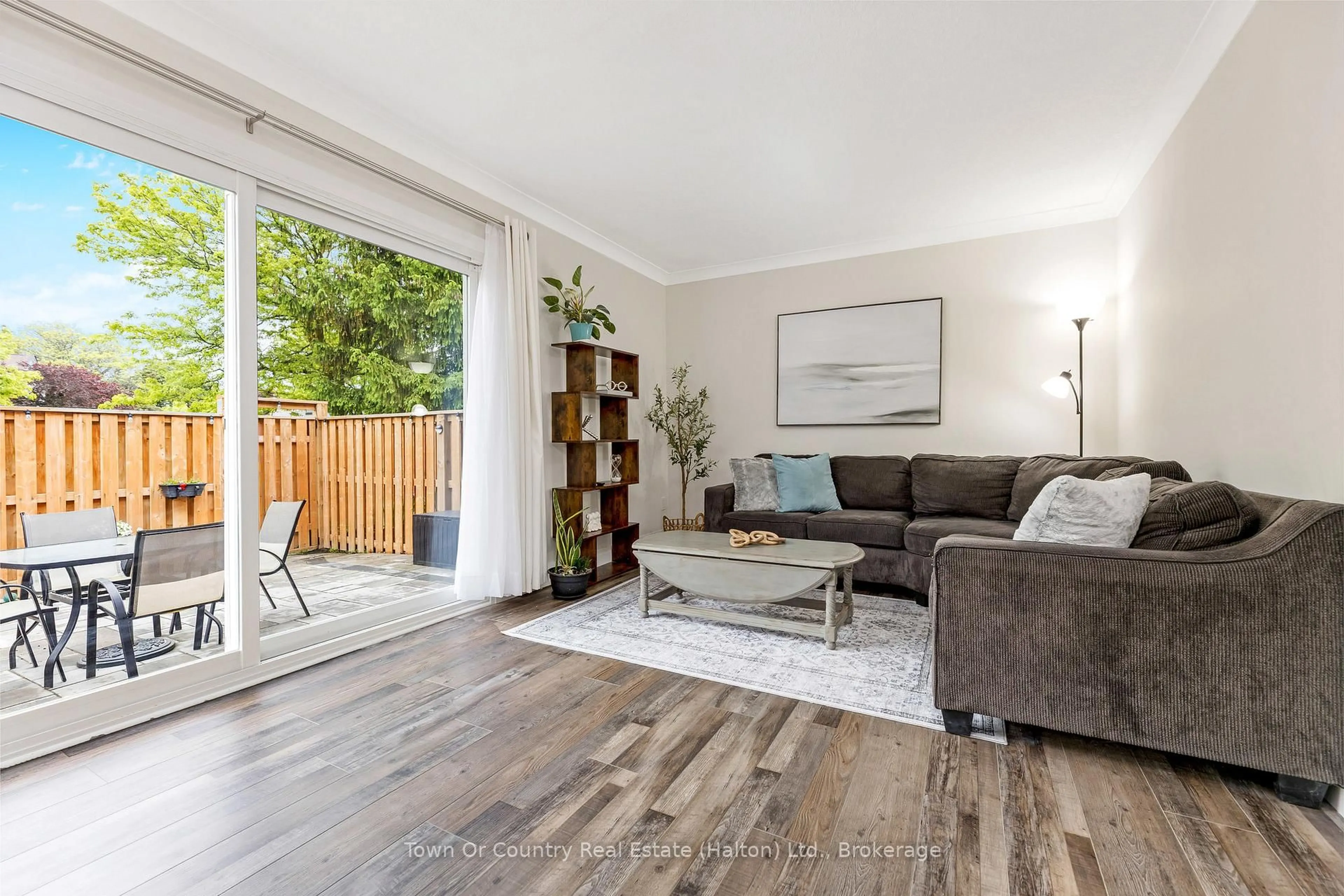 Living room with furniture, wood/laminate floor for 278 Wilson Dr #26, Milton Ontario L9T 3K2
