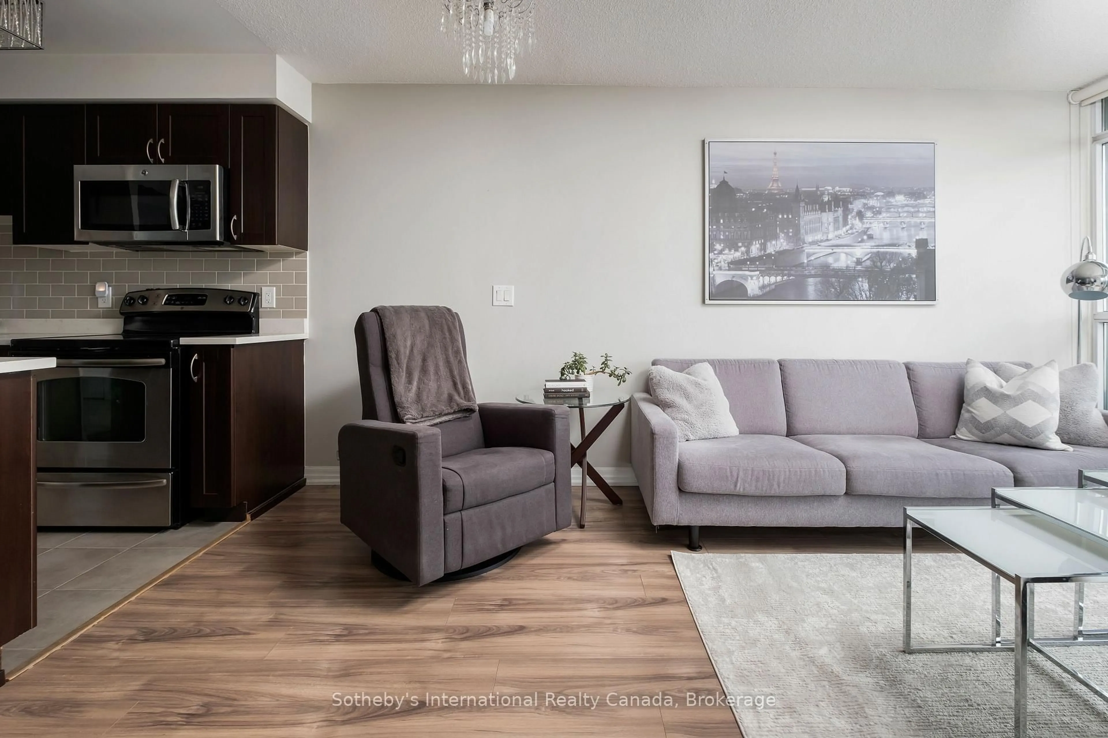 Living room with furniture, wood/laminate floor for 1940 Ironstone Dr #1101, Burlington Ontario L7L 0E4