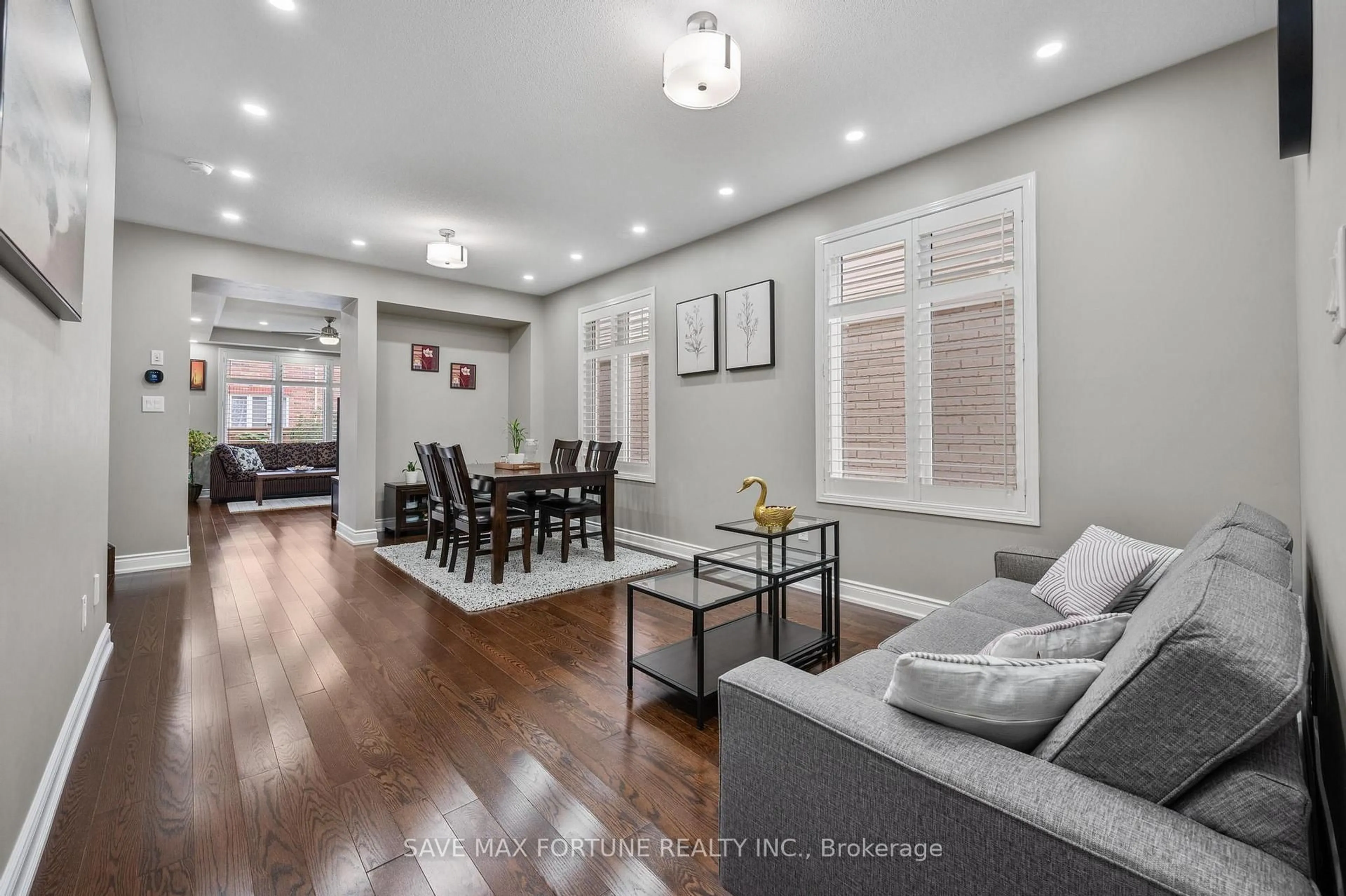 Living room with furniture, wood/laminate floor for 262 Cedric Terr, Milton Ontario L9T 8P1