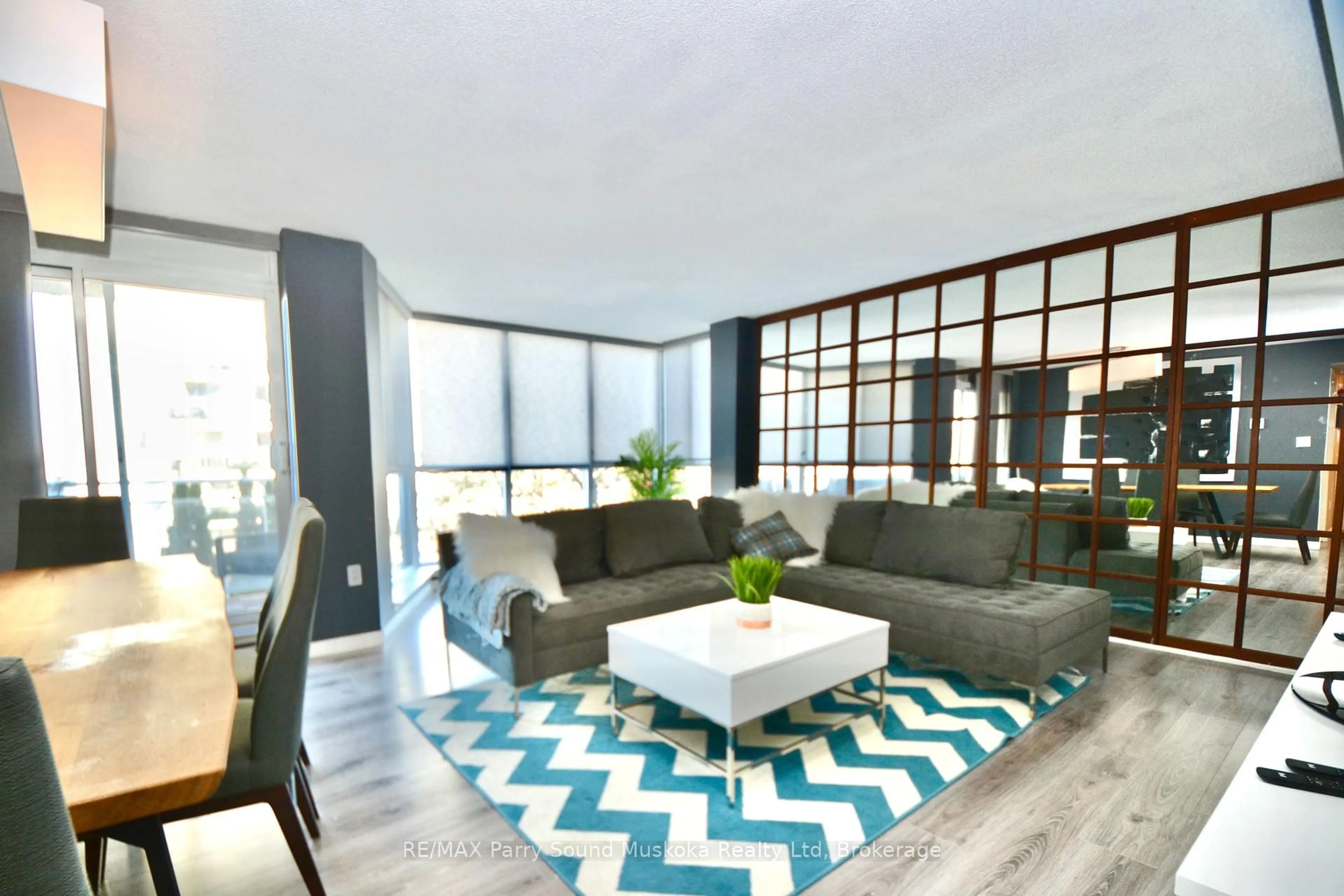 Living room with furniture, unknown for 1071 Queens Ave #205, Oakville Ontario L6H 2R5