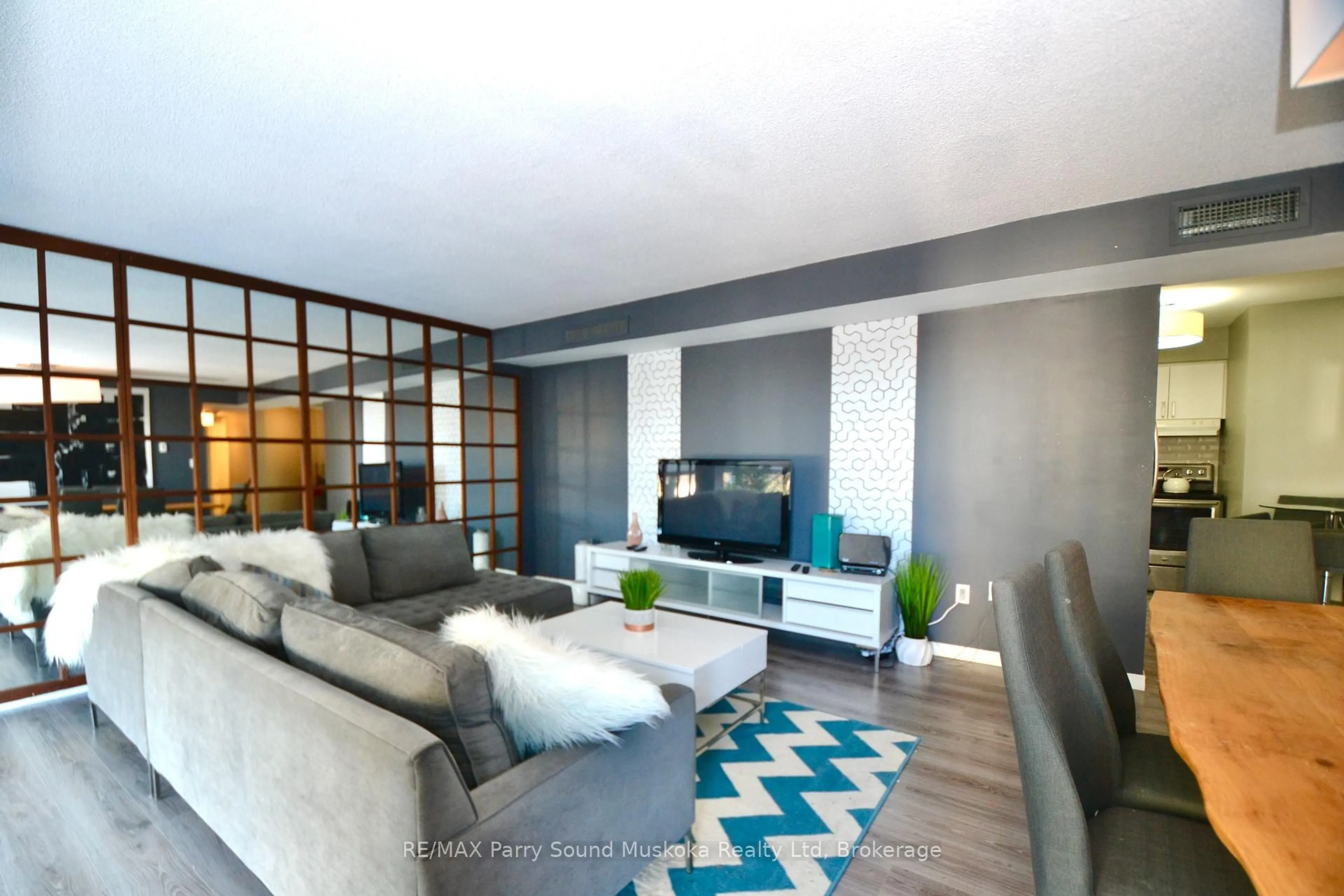 Living room with furniture, unknown for 1071 Queens Ave #205, Oakville Ontario L6H 2R5