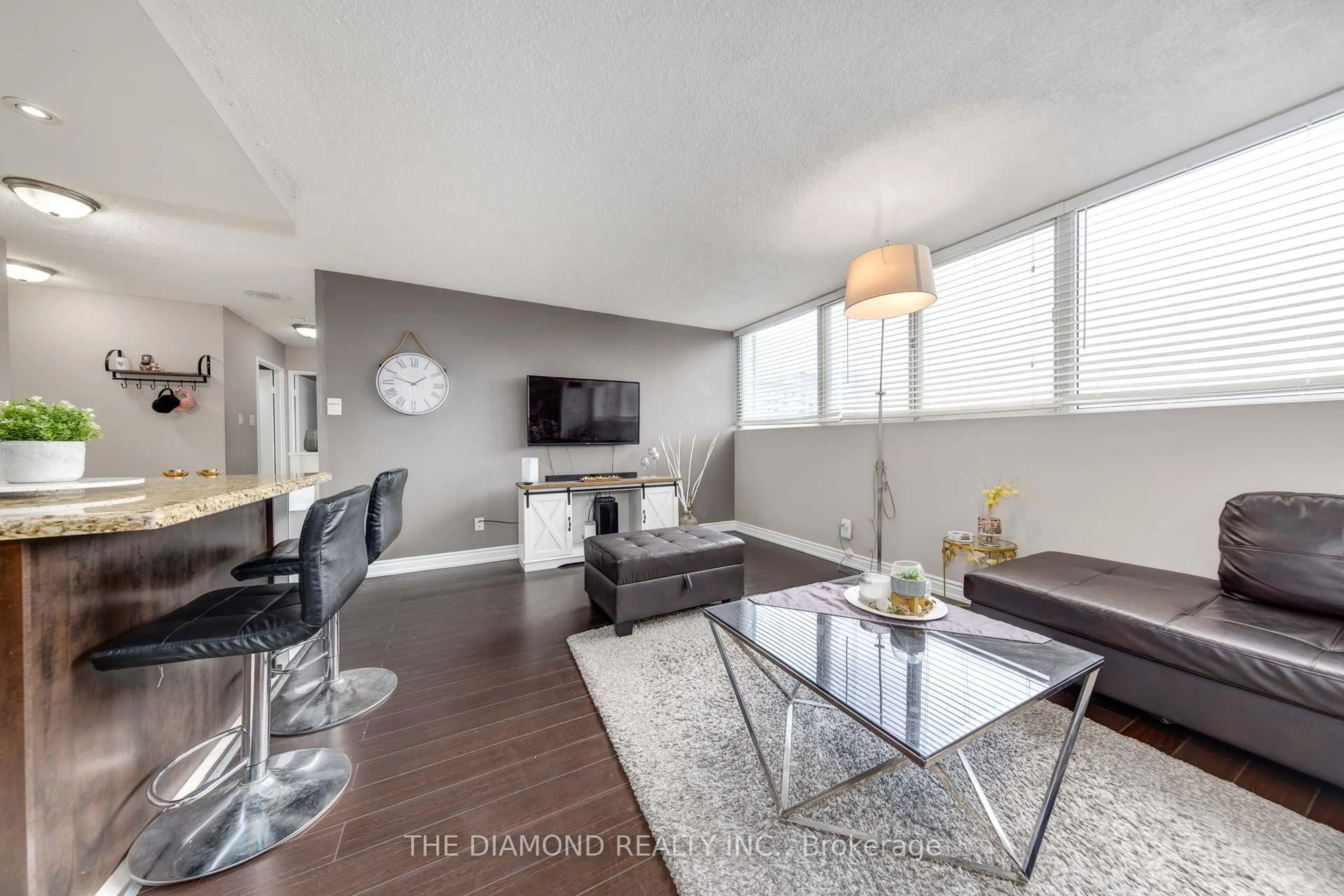 Living room with furniture, wood/laminate floor for 3700 Kaneff Cres #1507, Mississauga Ontario L5A 4B8