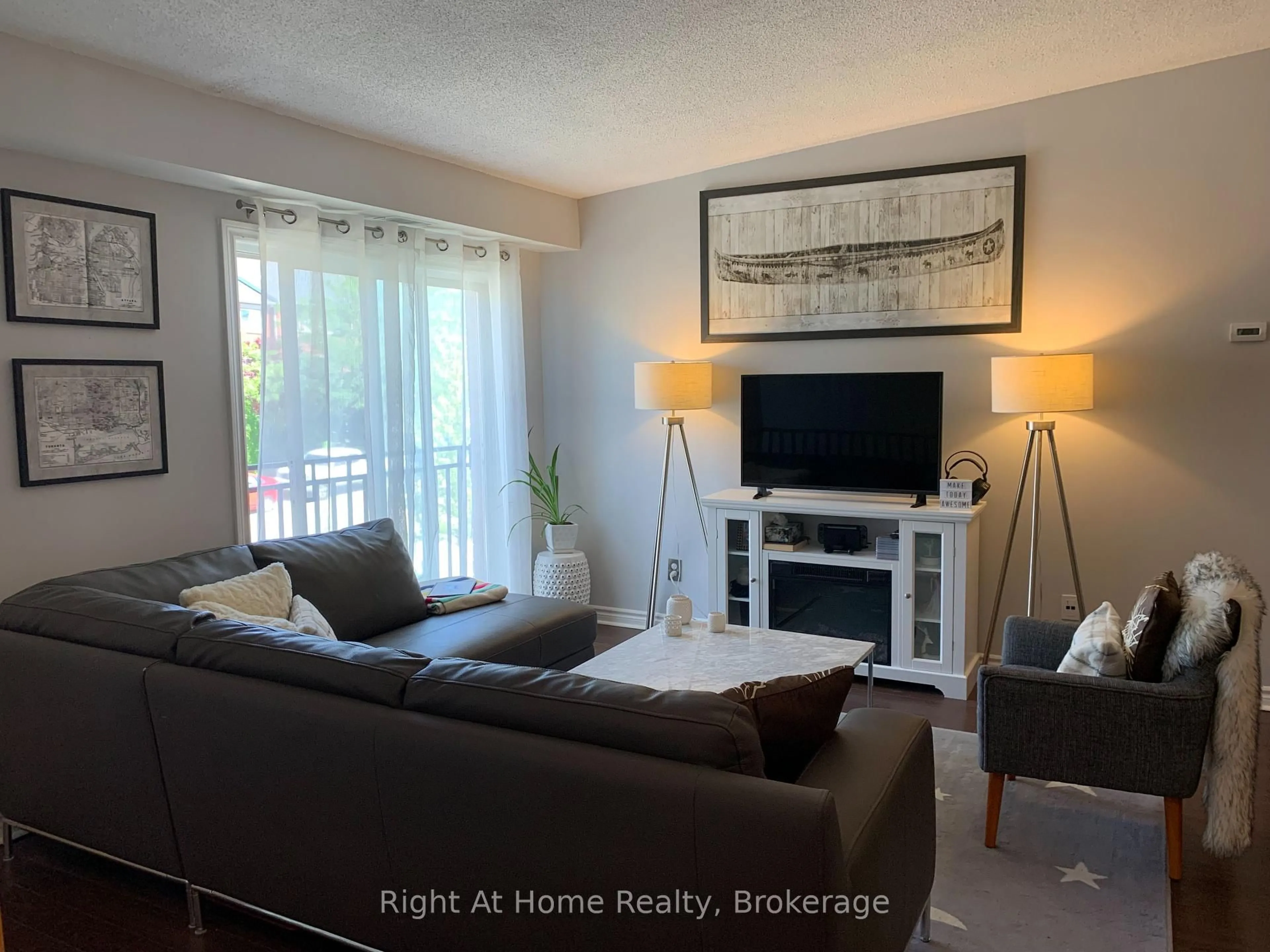Living room with furniture, wood/laminate floor for 1701 Lampman Ave #706, Burlington Ontario L7L 6R7