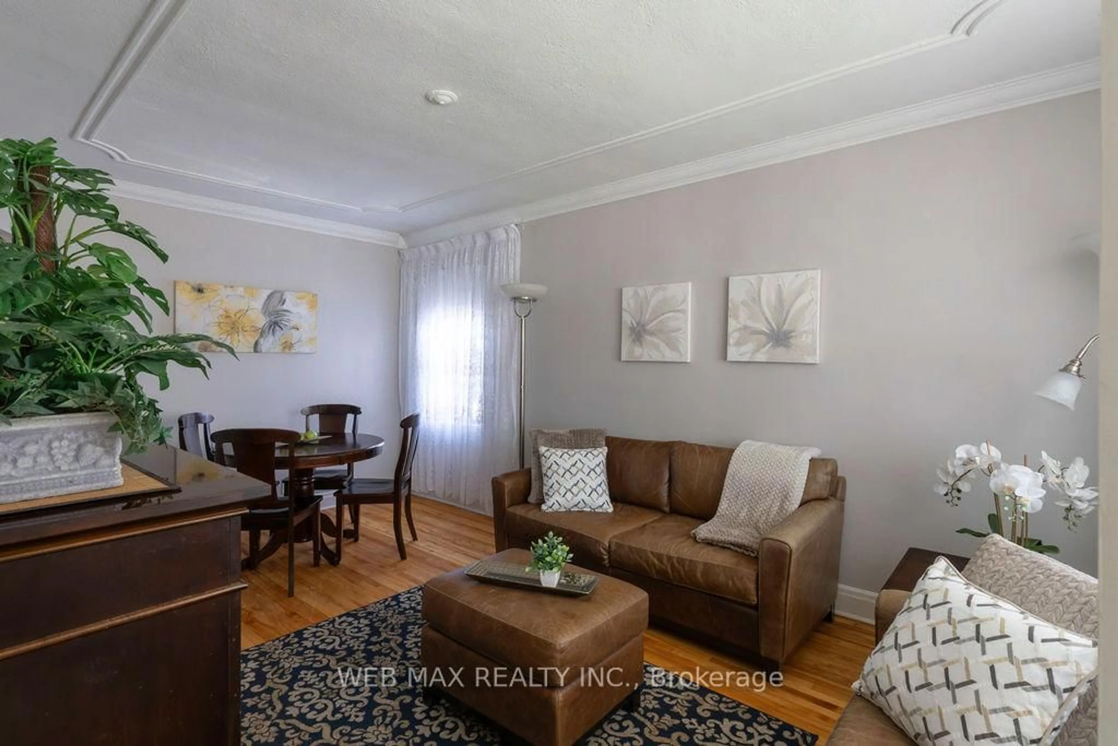 Living room with furniture, wood/laminate floor for 565 Glen Park Ave, Toronto Ontario M6B 2G4