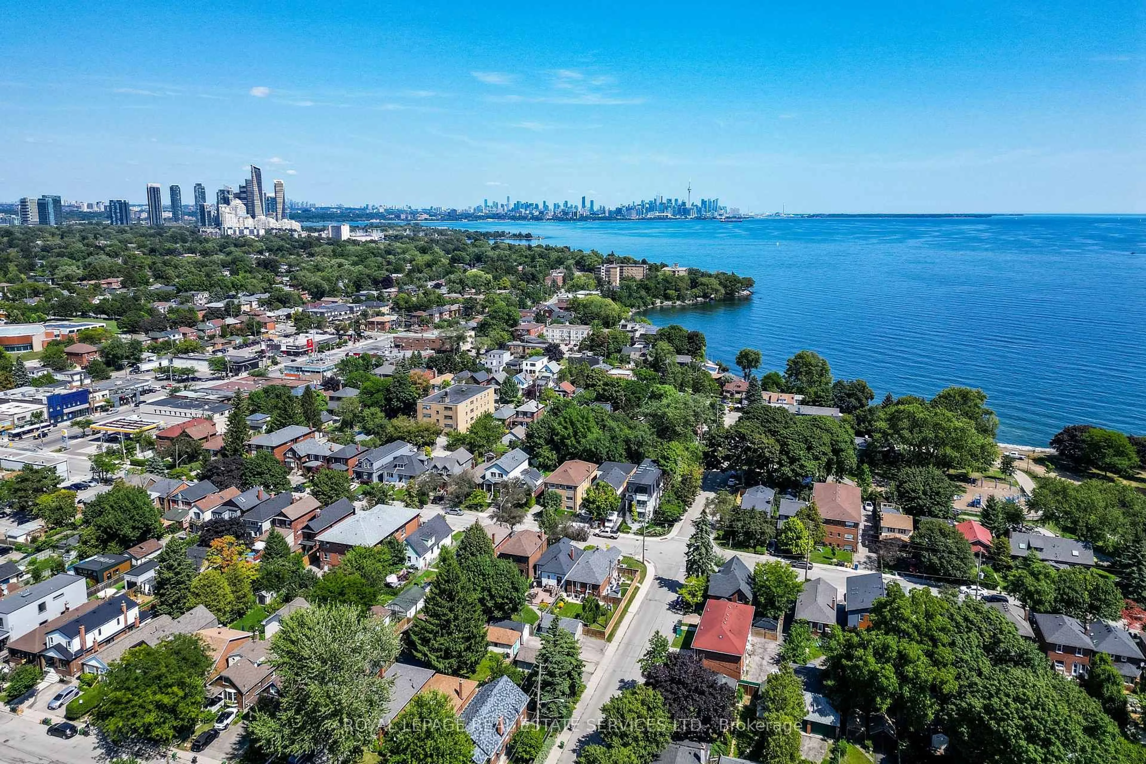 A pic from outside/outdoor area/front of a property/back of a property/a pic from drone, water/lake/river/ocean view for 83 Fourth St, Toronto Ontario M8V 2Y4