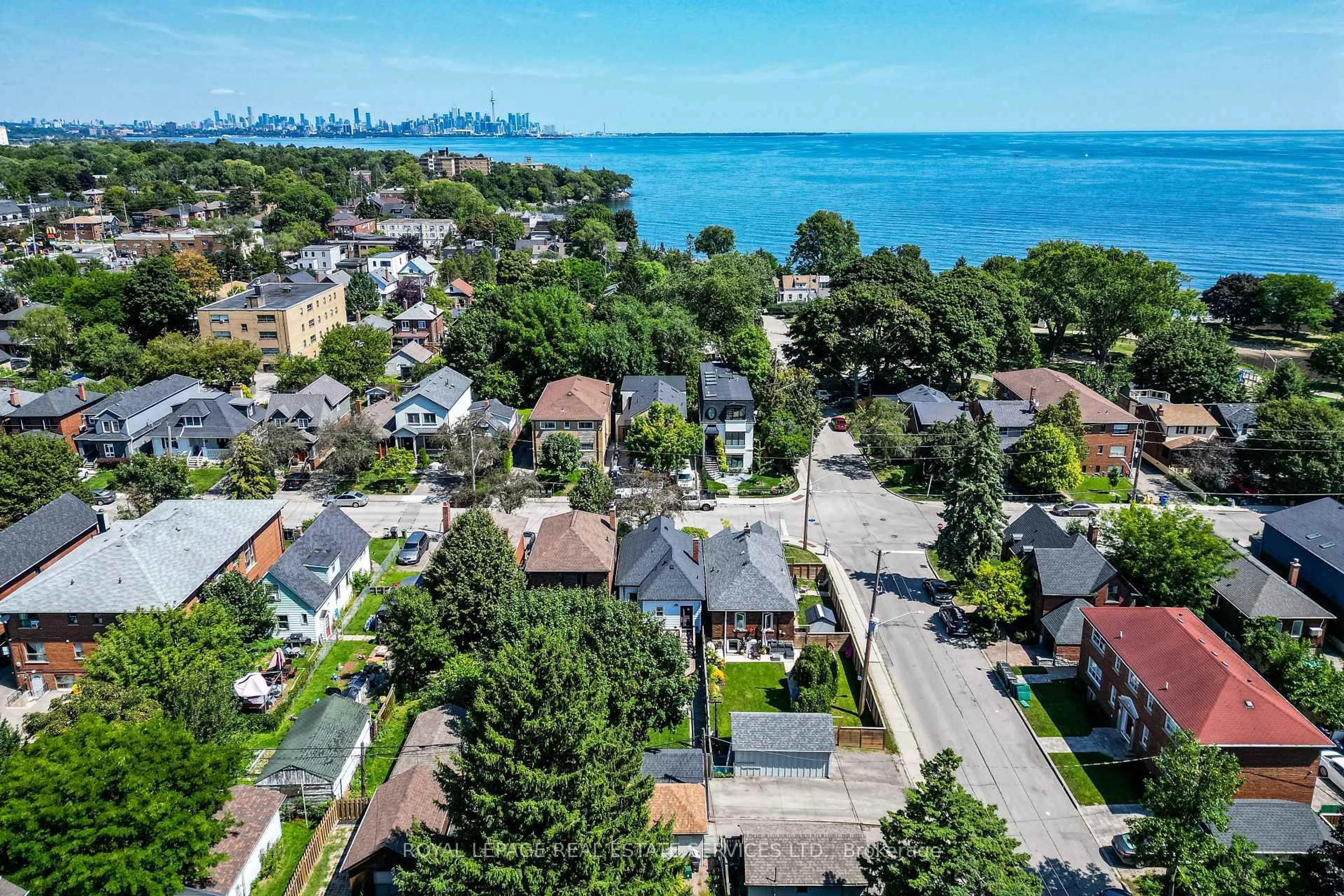A pic from outside/outdoor area/front of a property/back of a property/a pic from drone, water/lake/river/ocean view for 83 Fourth St, Toronto Ontario M8V 2Y4