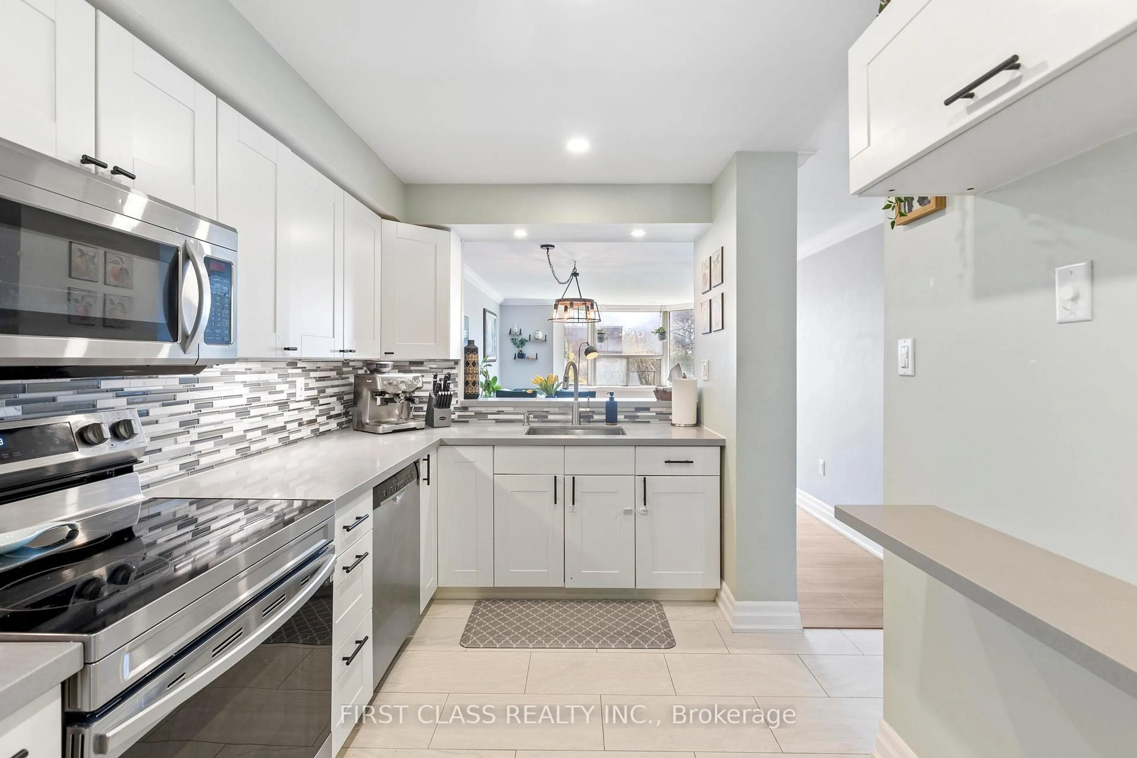 Open concept kitchen, ceramic/tile floor for 3845 Lake Shore Blvd #102, Toronto Ontario M8W 4Y3