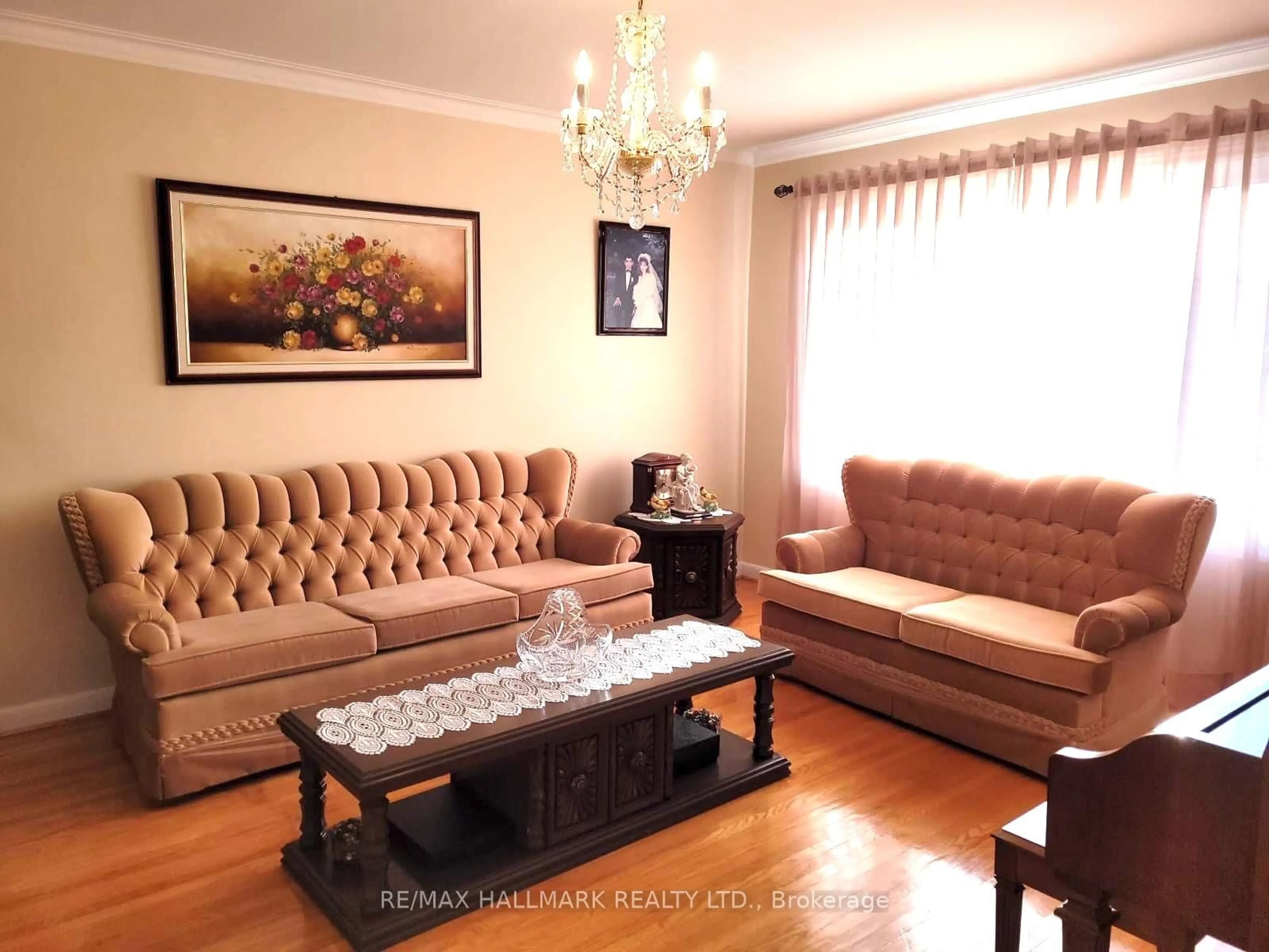 Living room with furniture, wood/laminate floor for 35 Clairton Cres, Toronto Ontario M6N 2M7