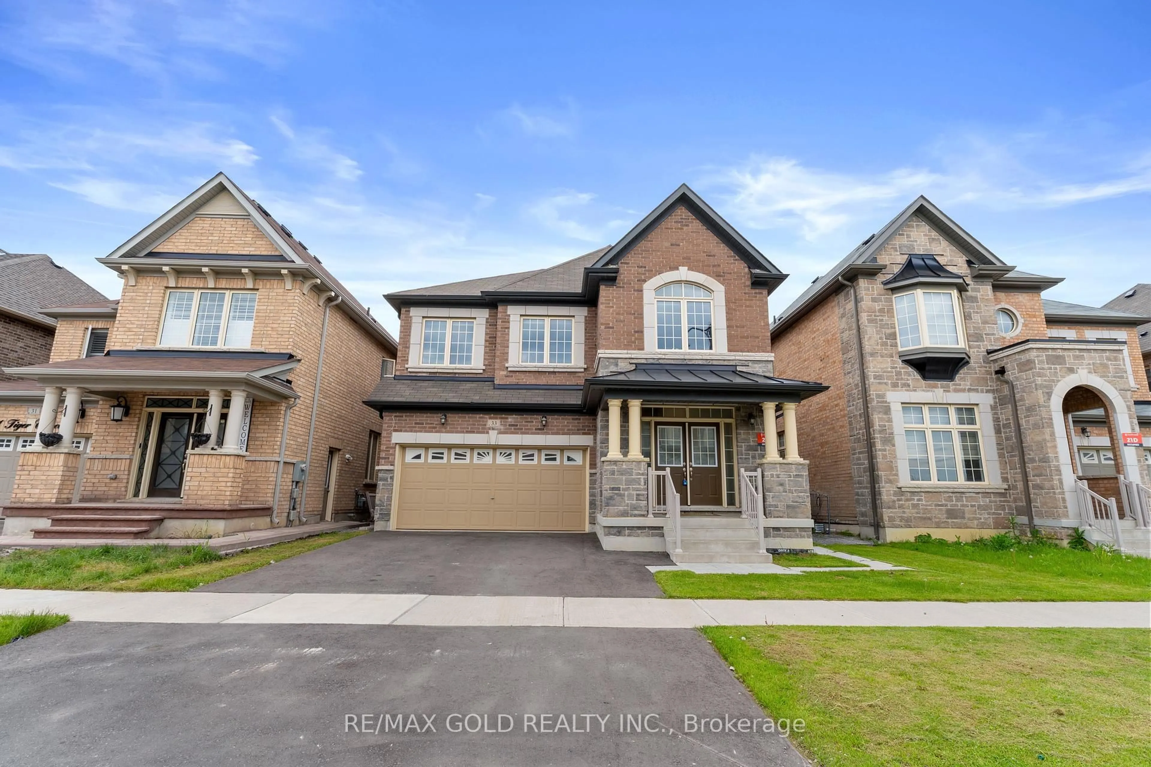Home with brick exterior material, street for 33 Tiger Cres, Brampton Ontario L6R 0C8