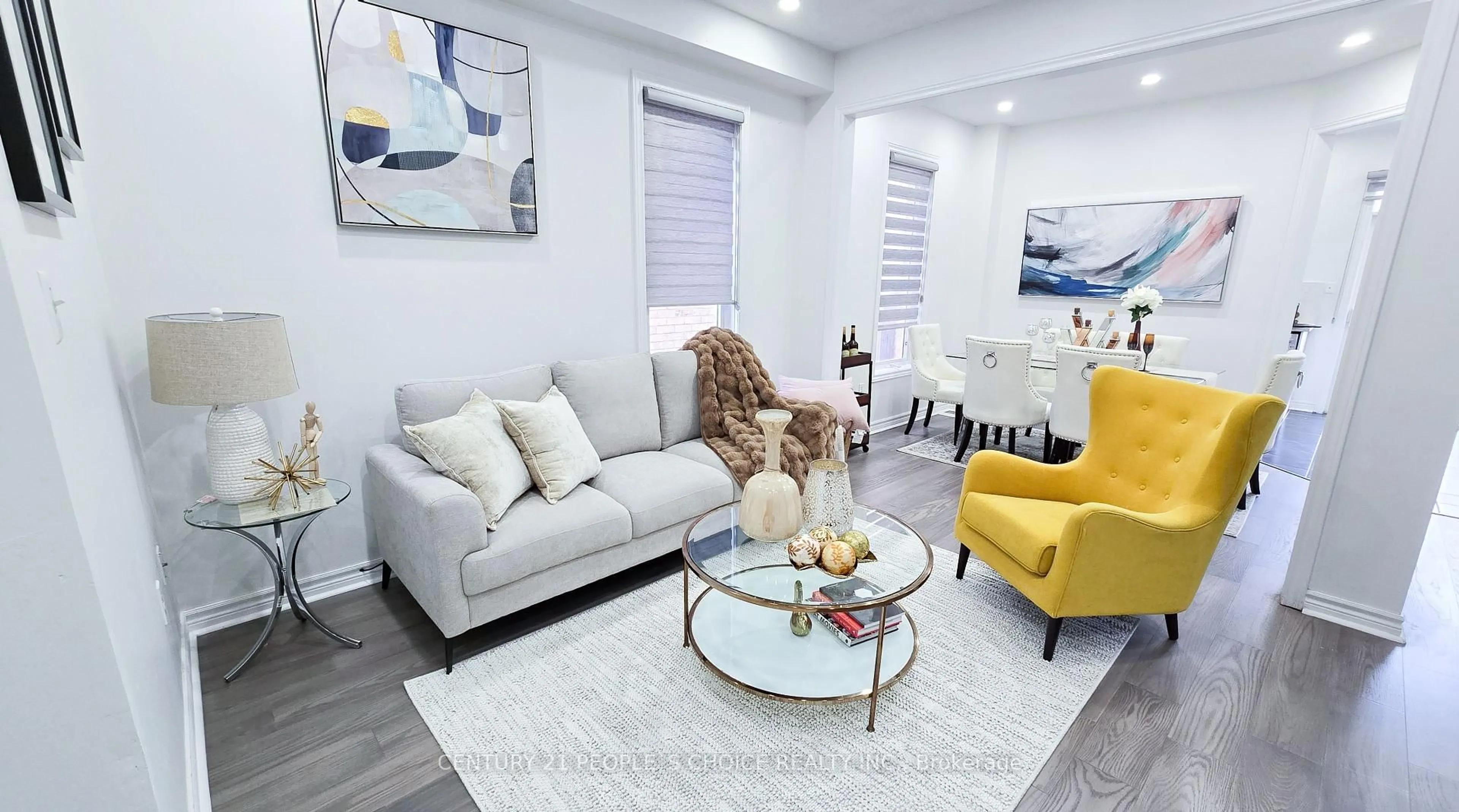 Living room with furniture, wood/laminate floor for 42 Deepcoral Crt, Brampton Ontario L6V 4P7