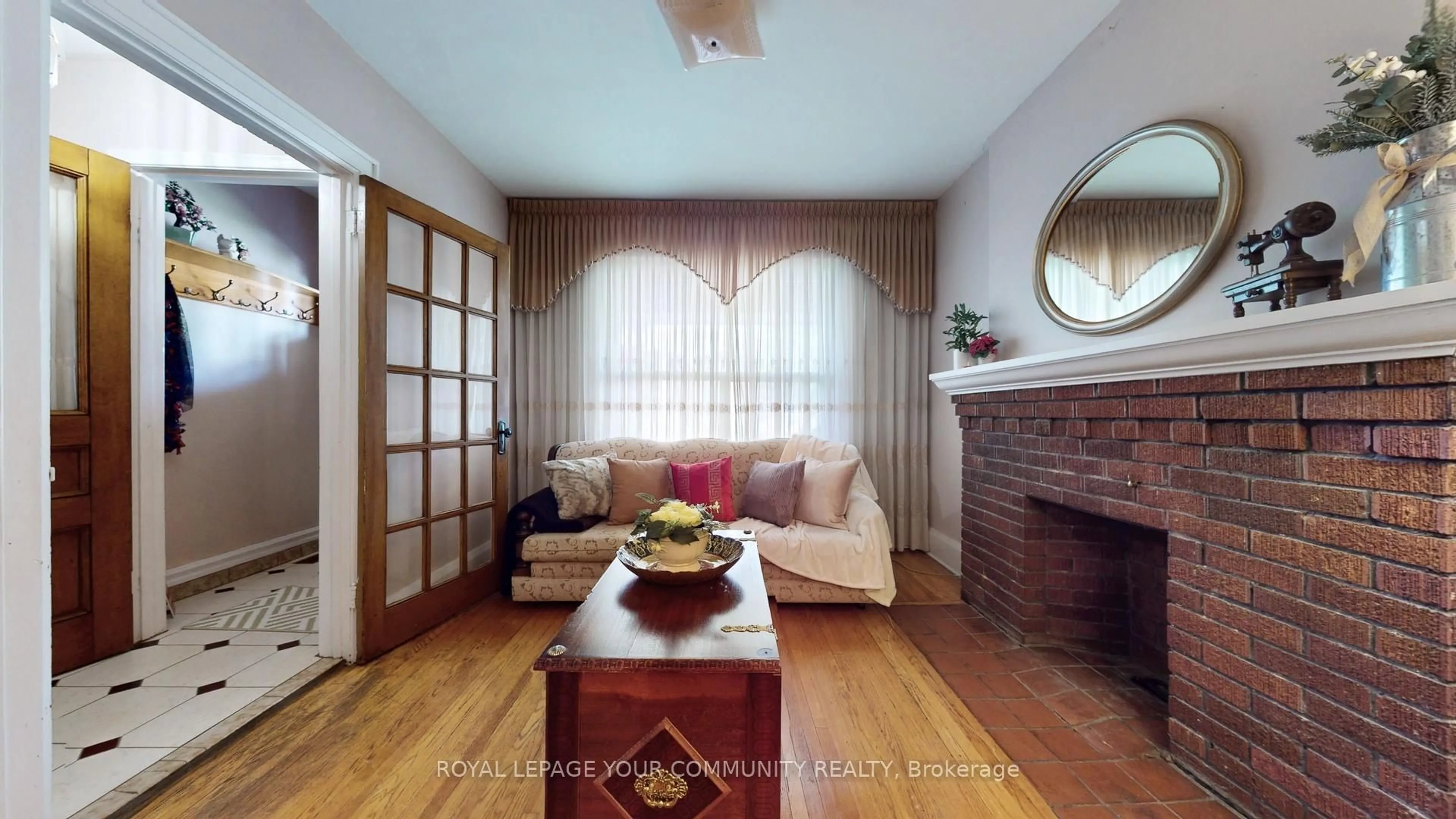 Living room with furniture, wood/laminate floor for 147 Nairn Ave, Toronto Ontario M6E 4G9