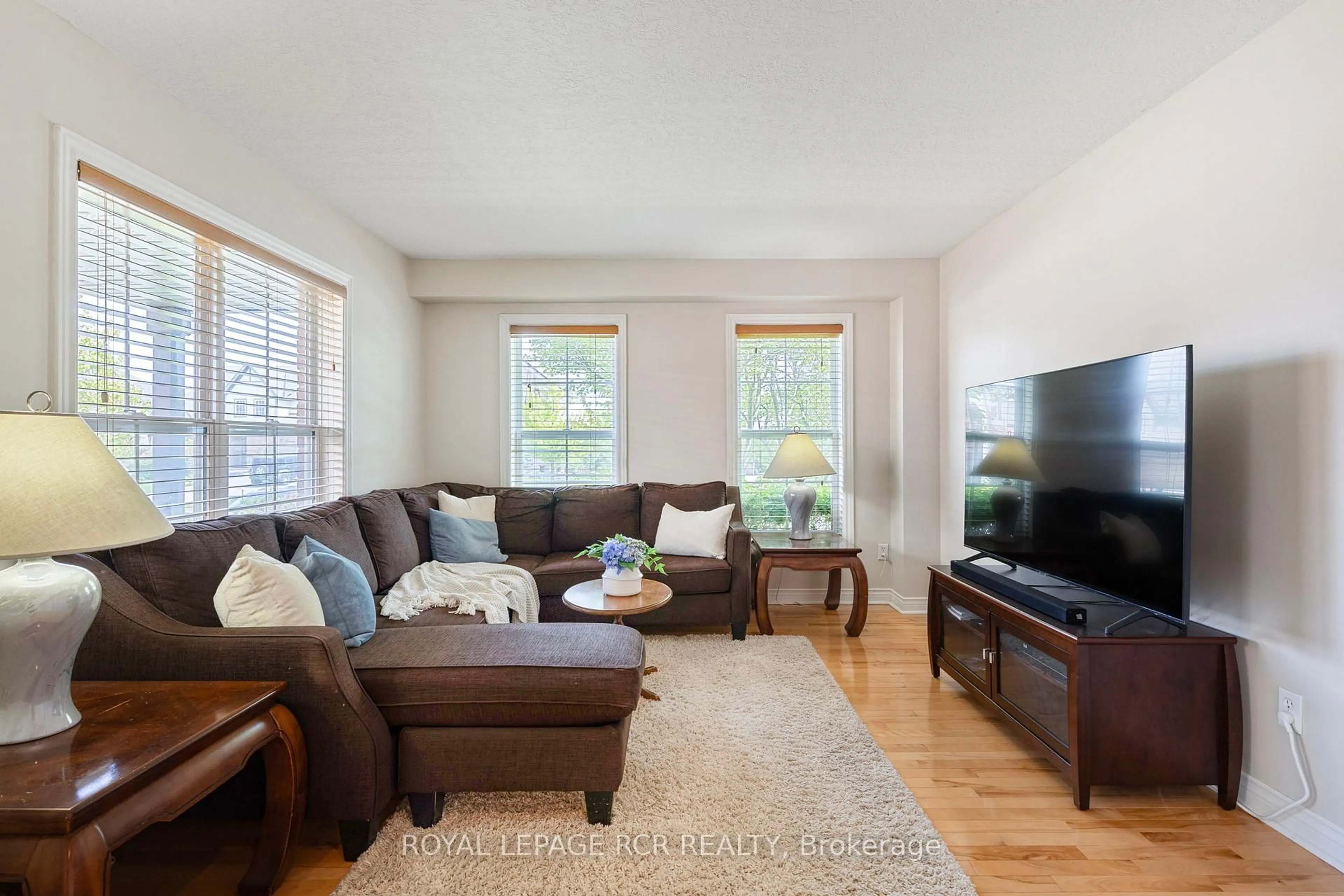 Living room with furniture, wood/laminate floor for 69 Spencer Ave, Orangeville Ontario L9W 5E7