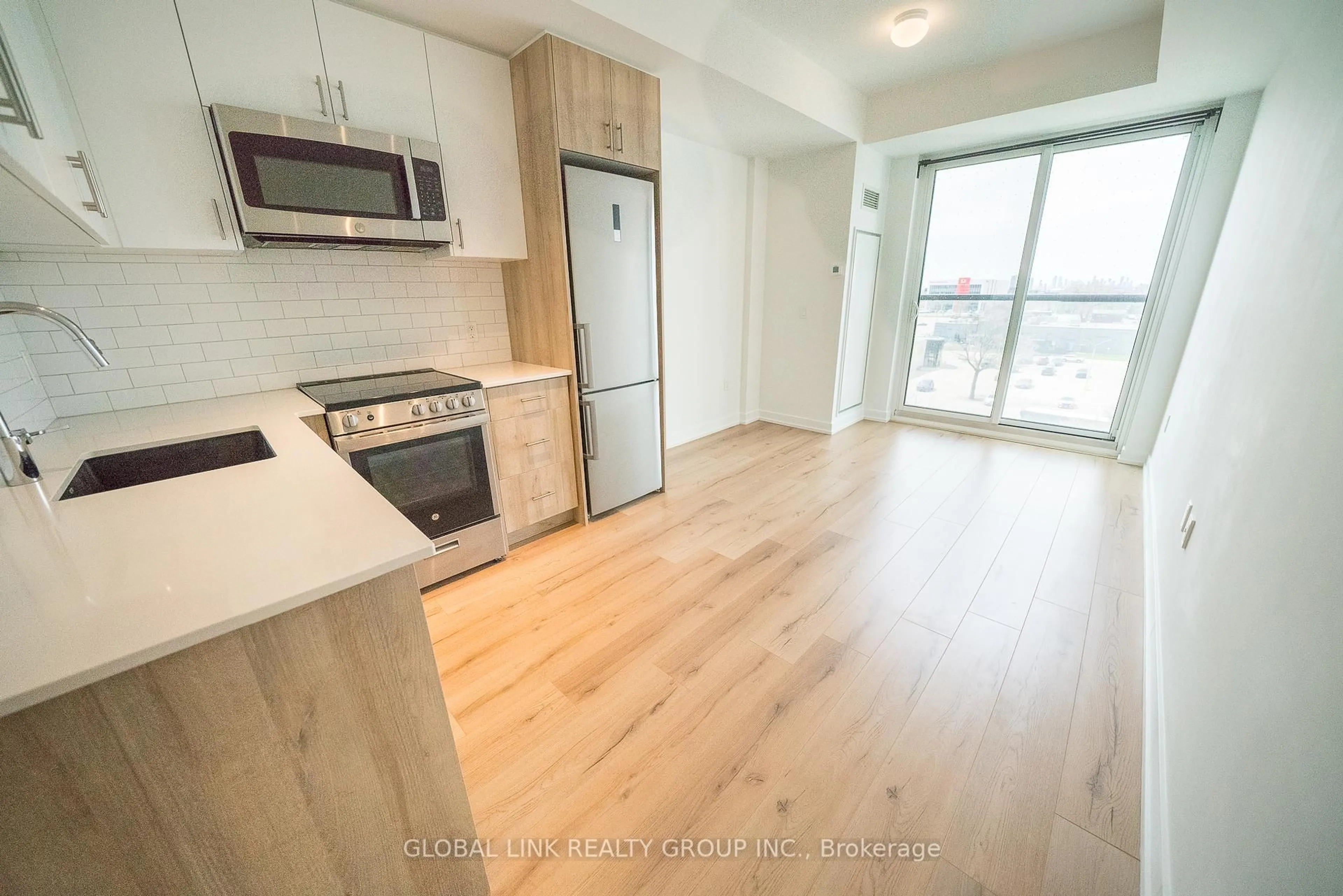 Open concept kitchen, wood/laminate floor for 1195 The Queensway Way #501, Toronto Ontario M8Z 0H1