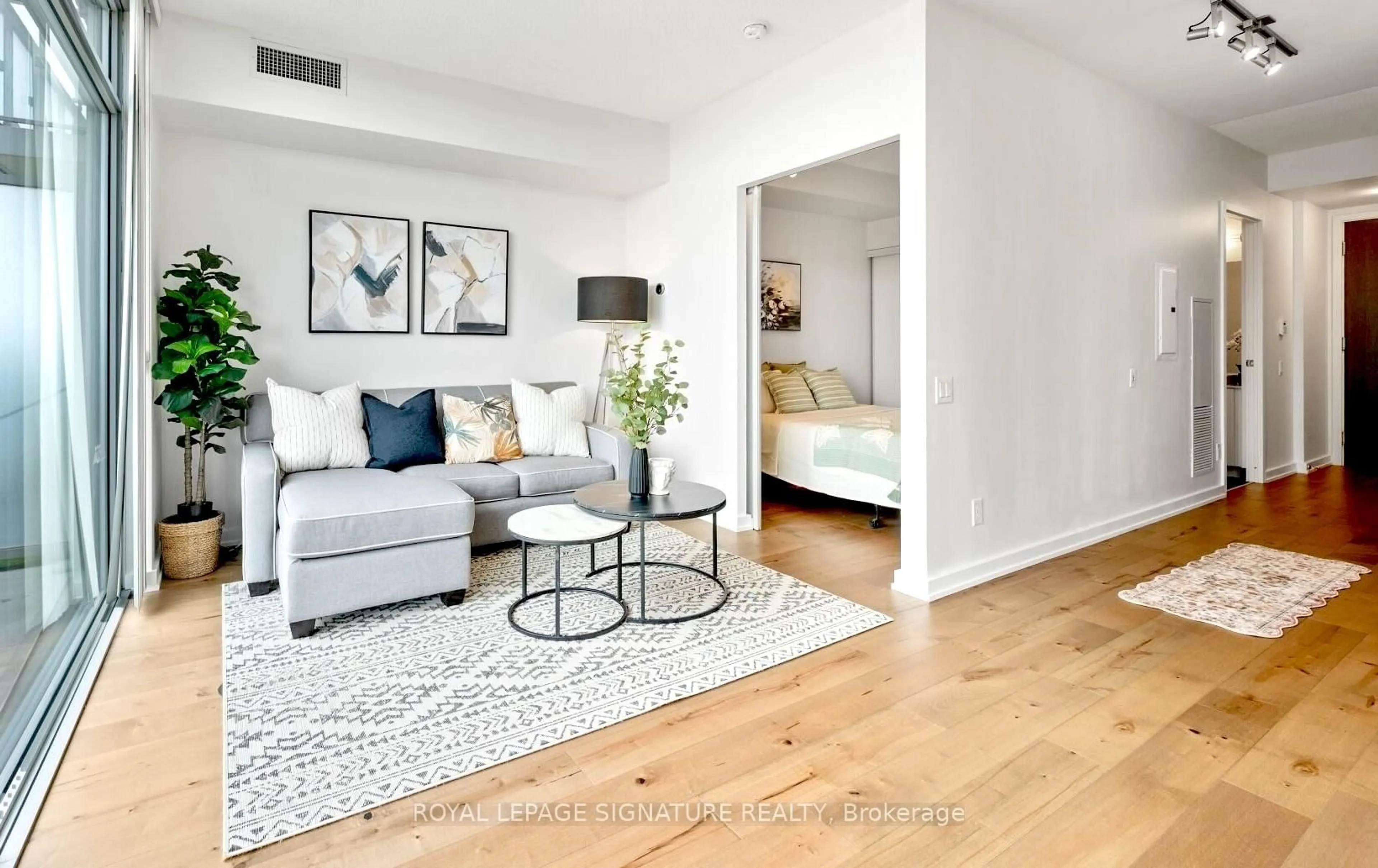 Living room with furniture, wood/laminate floor for 105 The Queens Way #1813, Toronto Ontario M6S 5B5