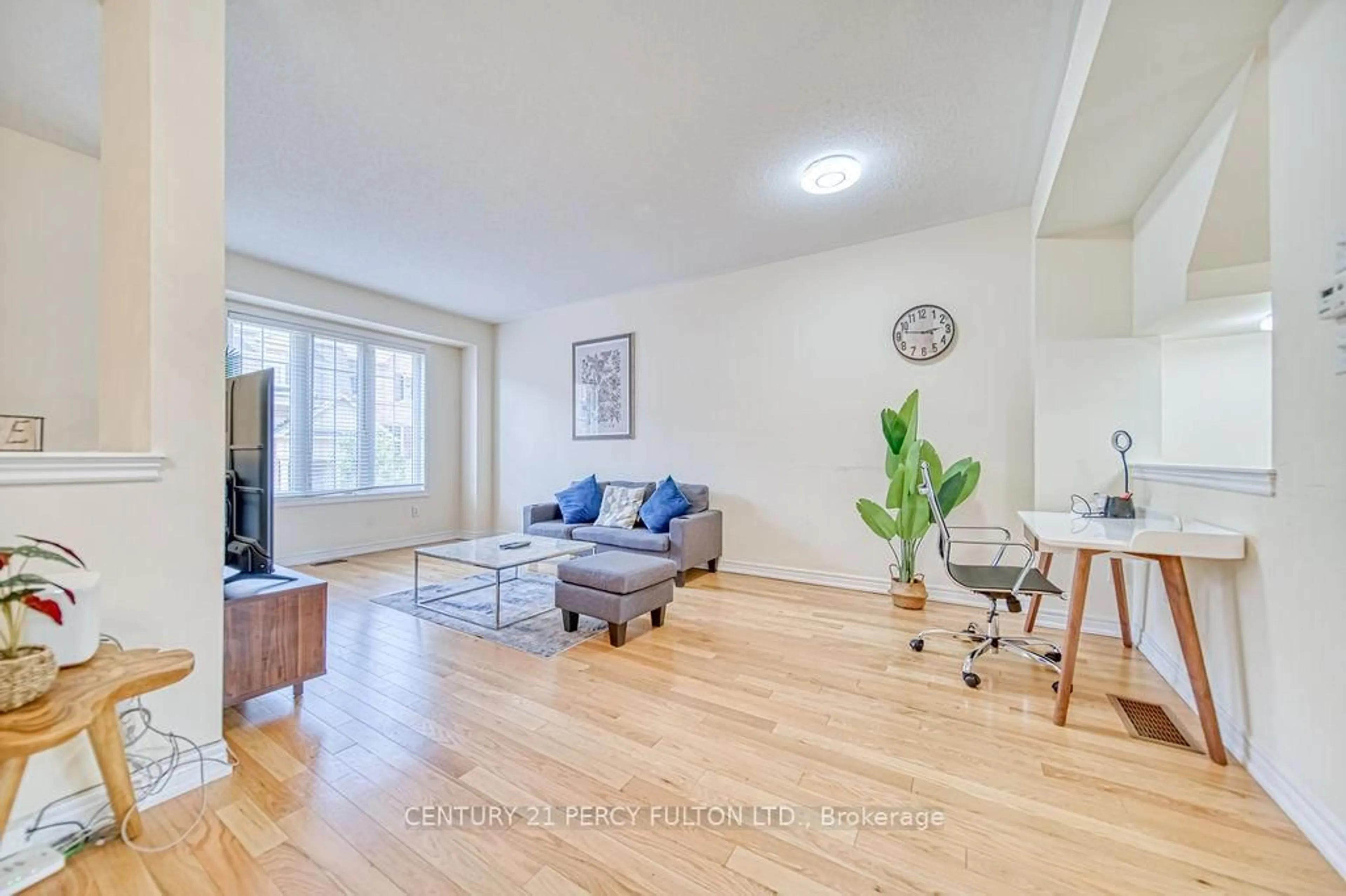 Living room with furniture, wood/laminate floor for 142 Sea Drifter Cres, Brampton Ontario L6P 4B1