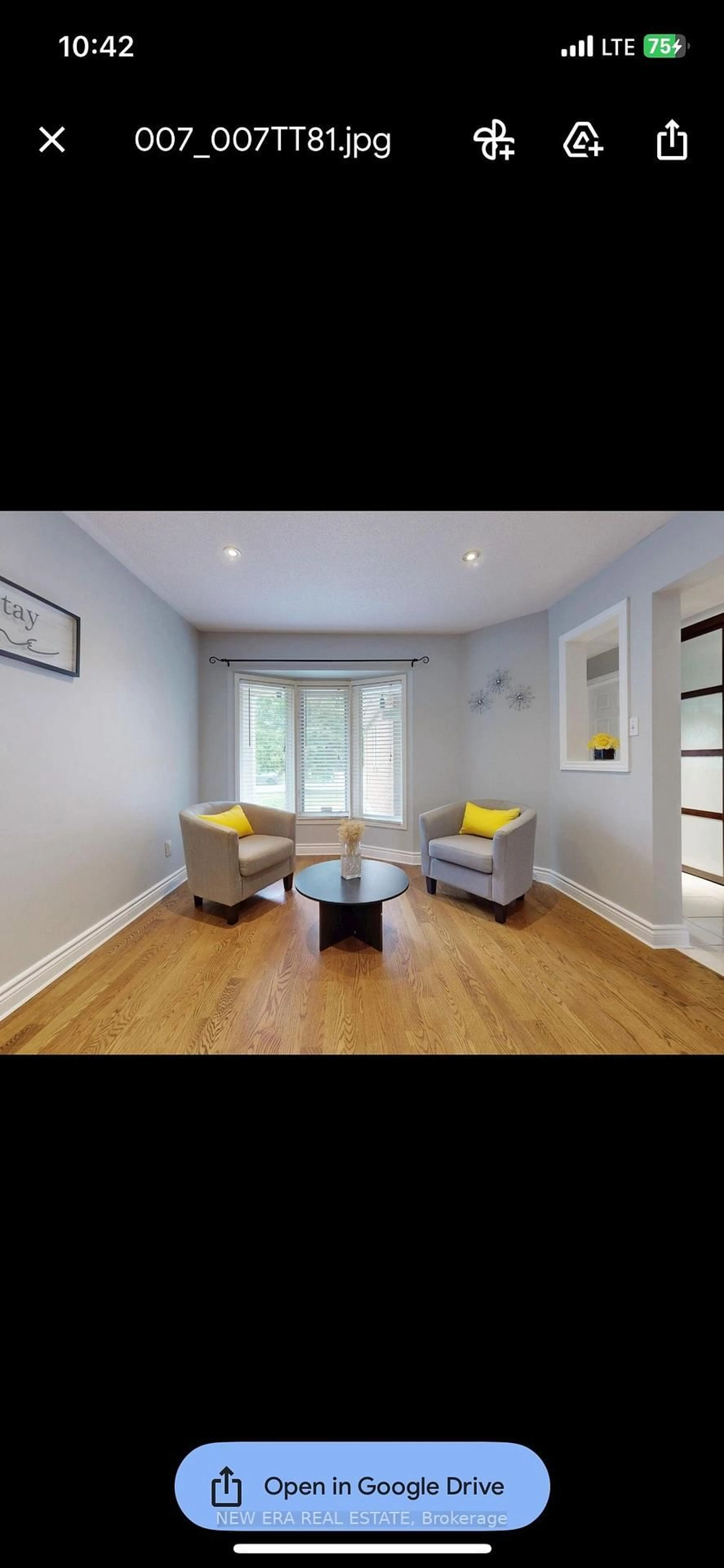 Living room with furniture, wood/laminate floor for 5380 Floral Hill Cres, Mississauga Ontario L5V 1V3