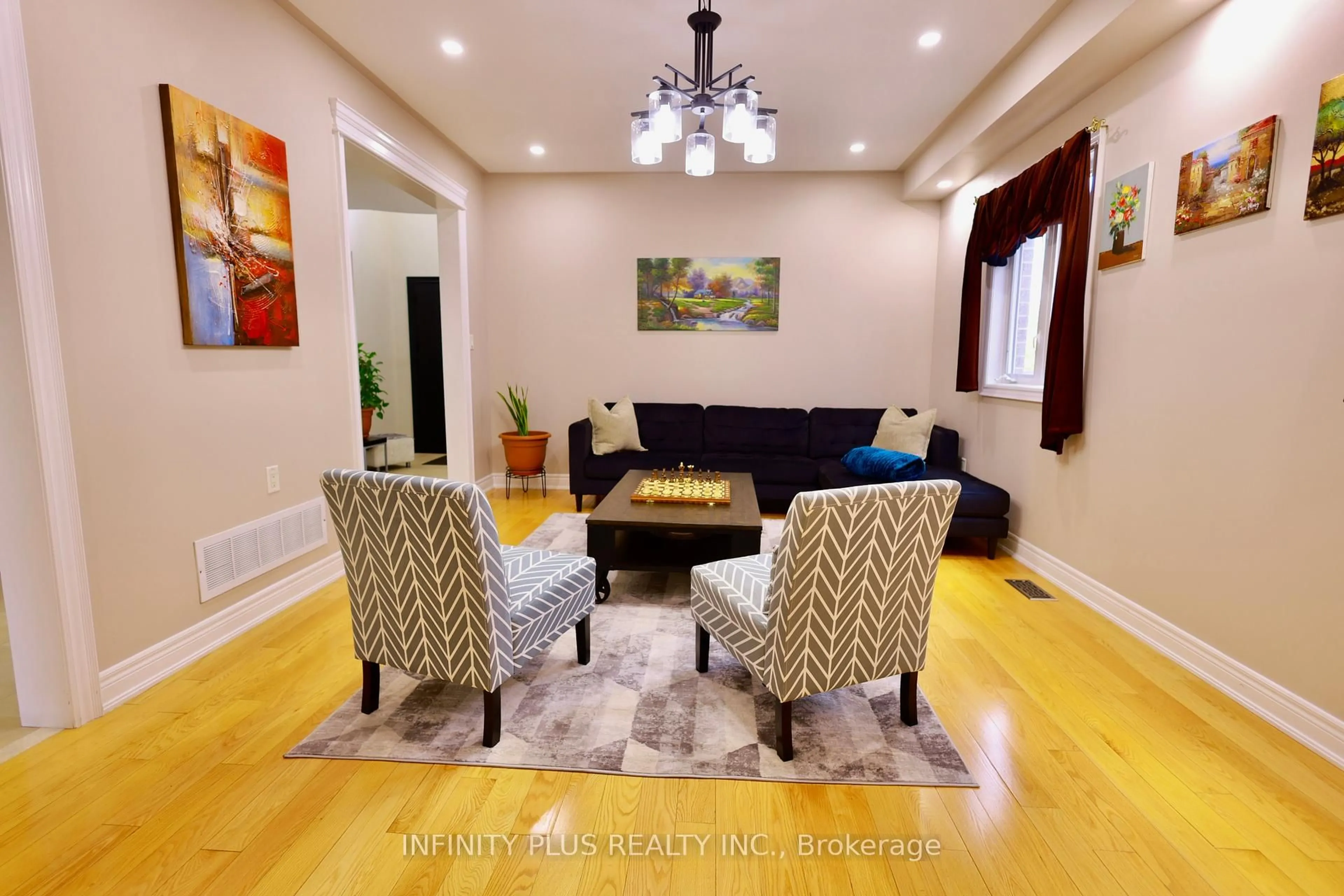 Living room with furniture, wood/laminate floor for 3 Lacoste Blvd, Brampton Ontario L6P 2K4