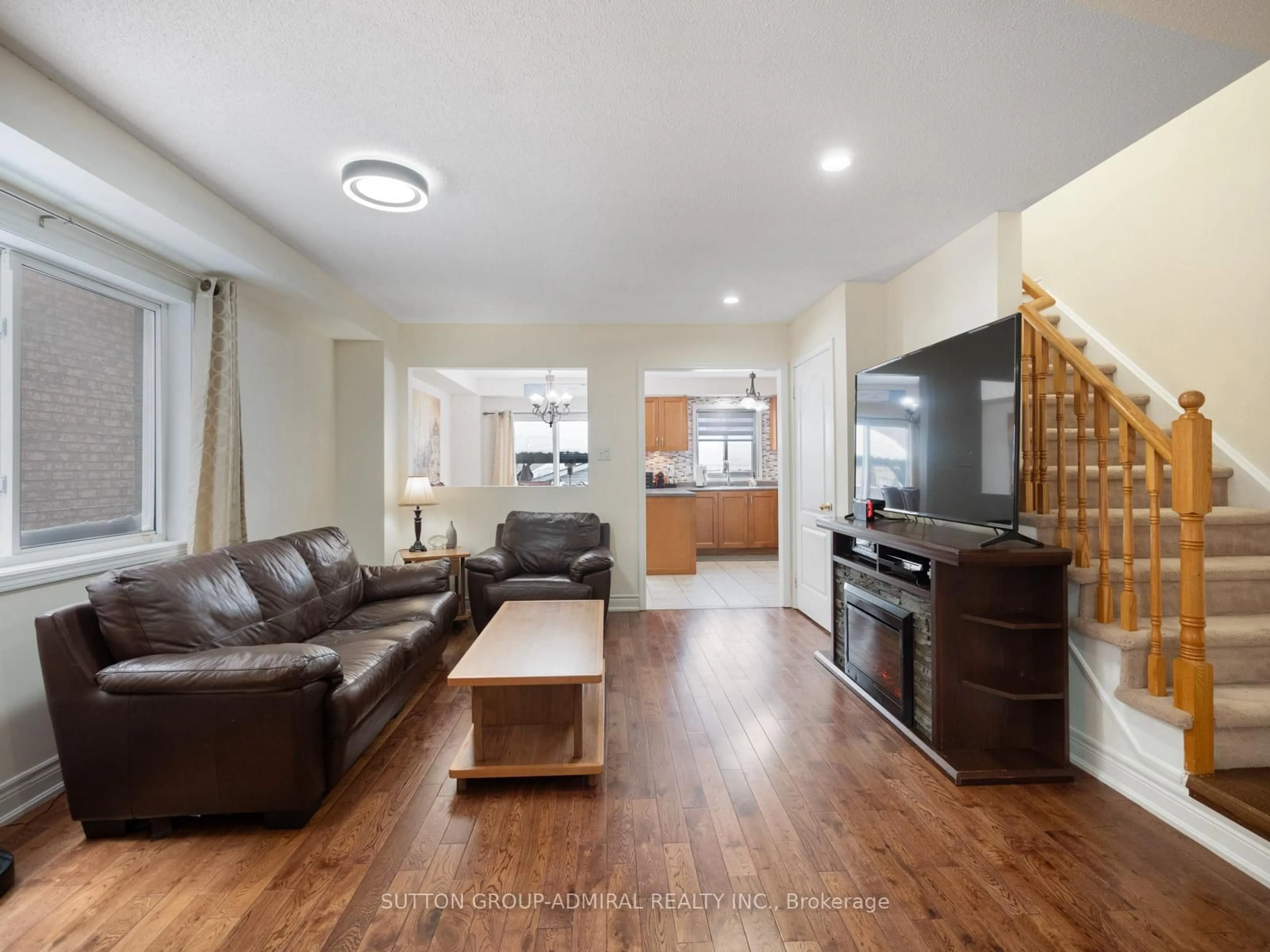 Living room with furniture, wood/laminate floor for 170 Tiller Tr, Brampton Ontario L6X 4S8