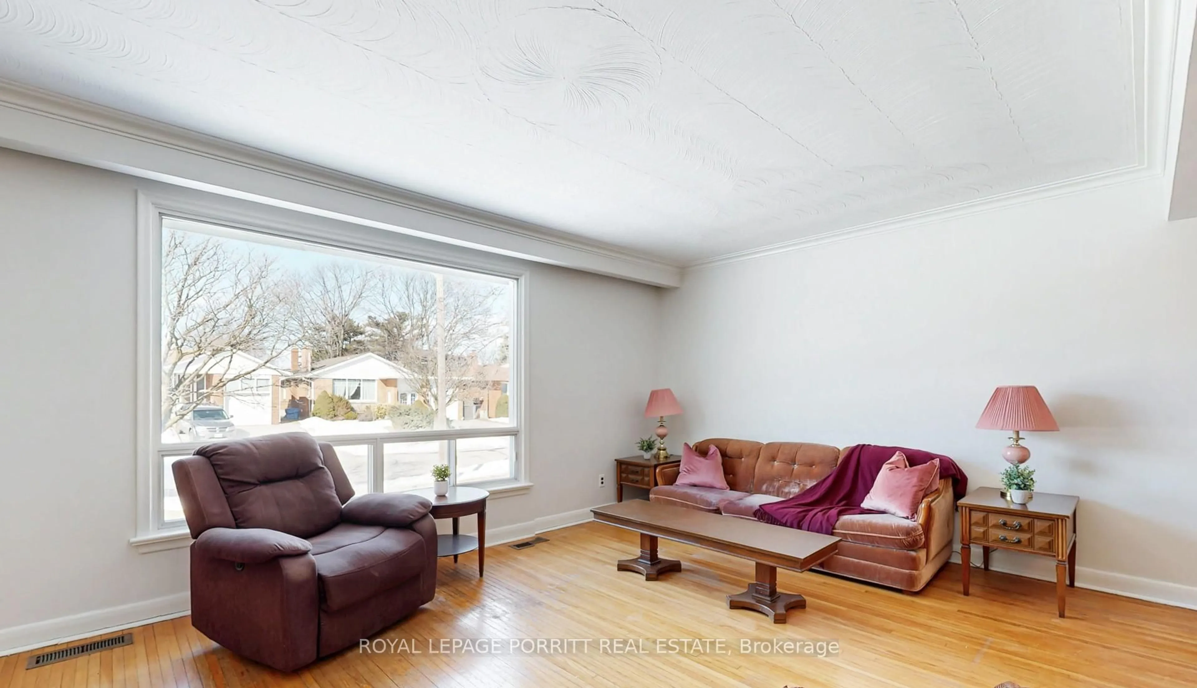 Living room with furniture, wood/laminate floor for 31 Badger Dr, Toronto Ontario M8Z 2M8