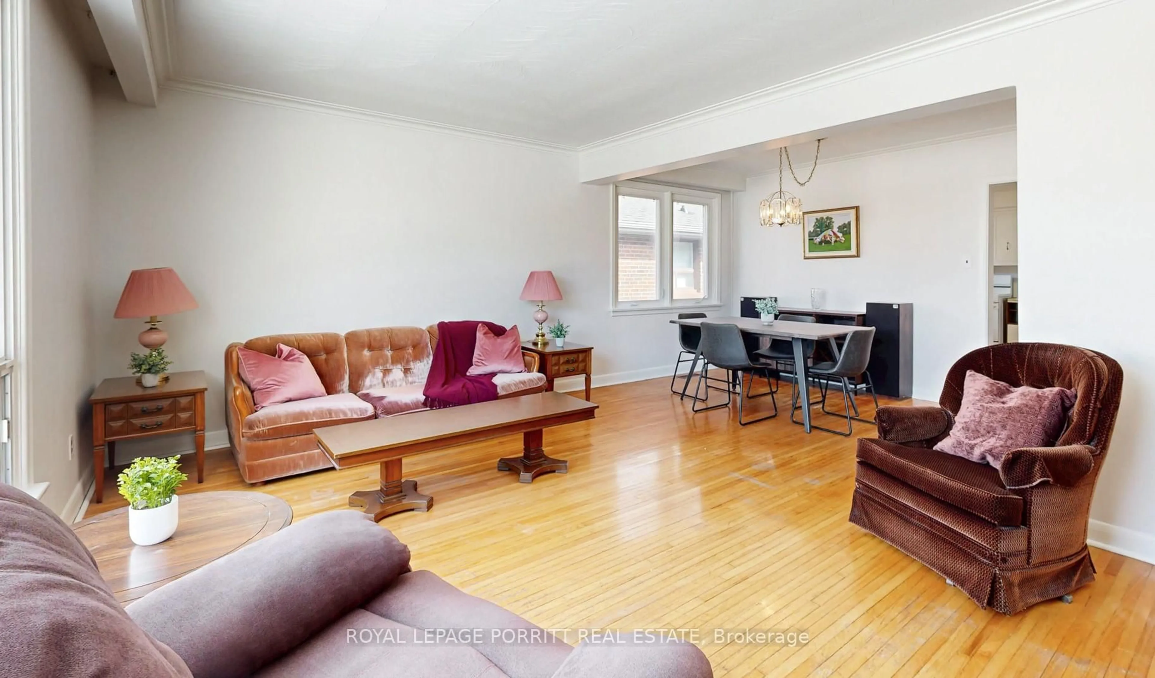 Living room with furniture, wood/laminate floor for 31 Badger Dr, Toronto Ontario M8Z 2M8