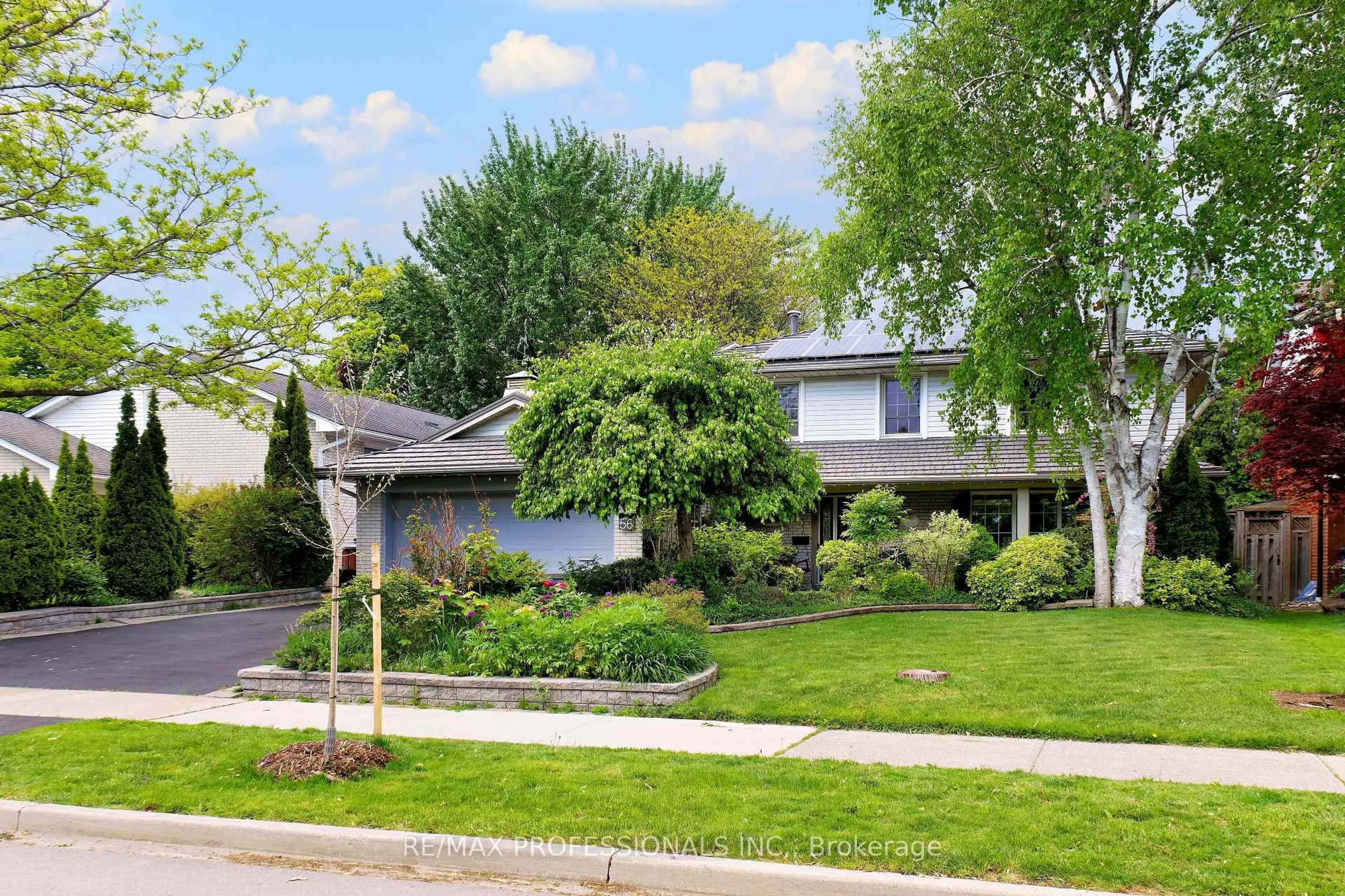 Home with vinyl exterior material, street for 56 Silverthorne Bush Dr, Toronto Ontario M9C 2X8