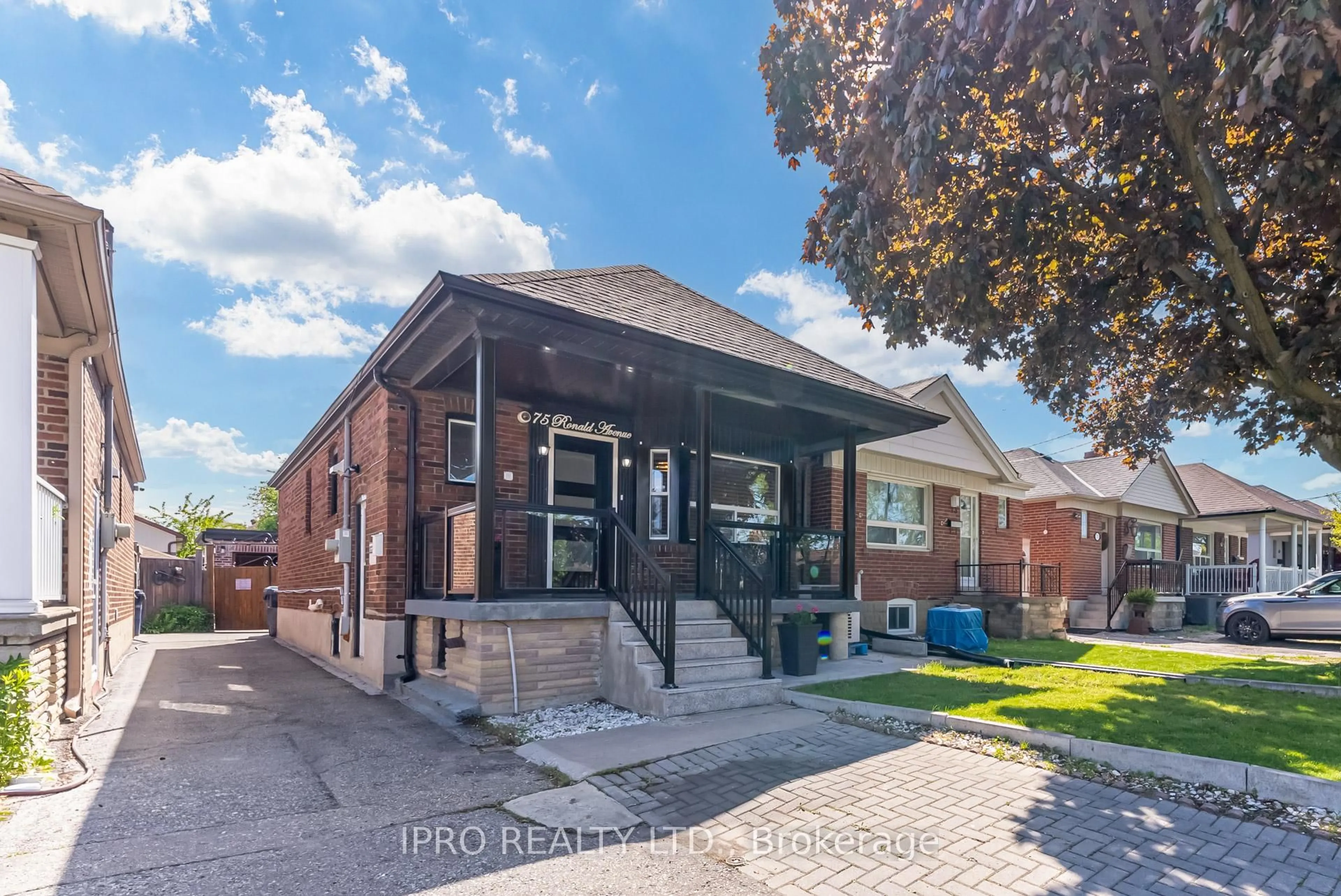 Home with brick exterior material, street for 75 Ronald Ave, Toronto Ontario M6E 4M8