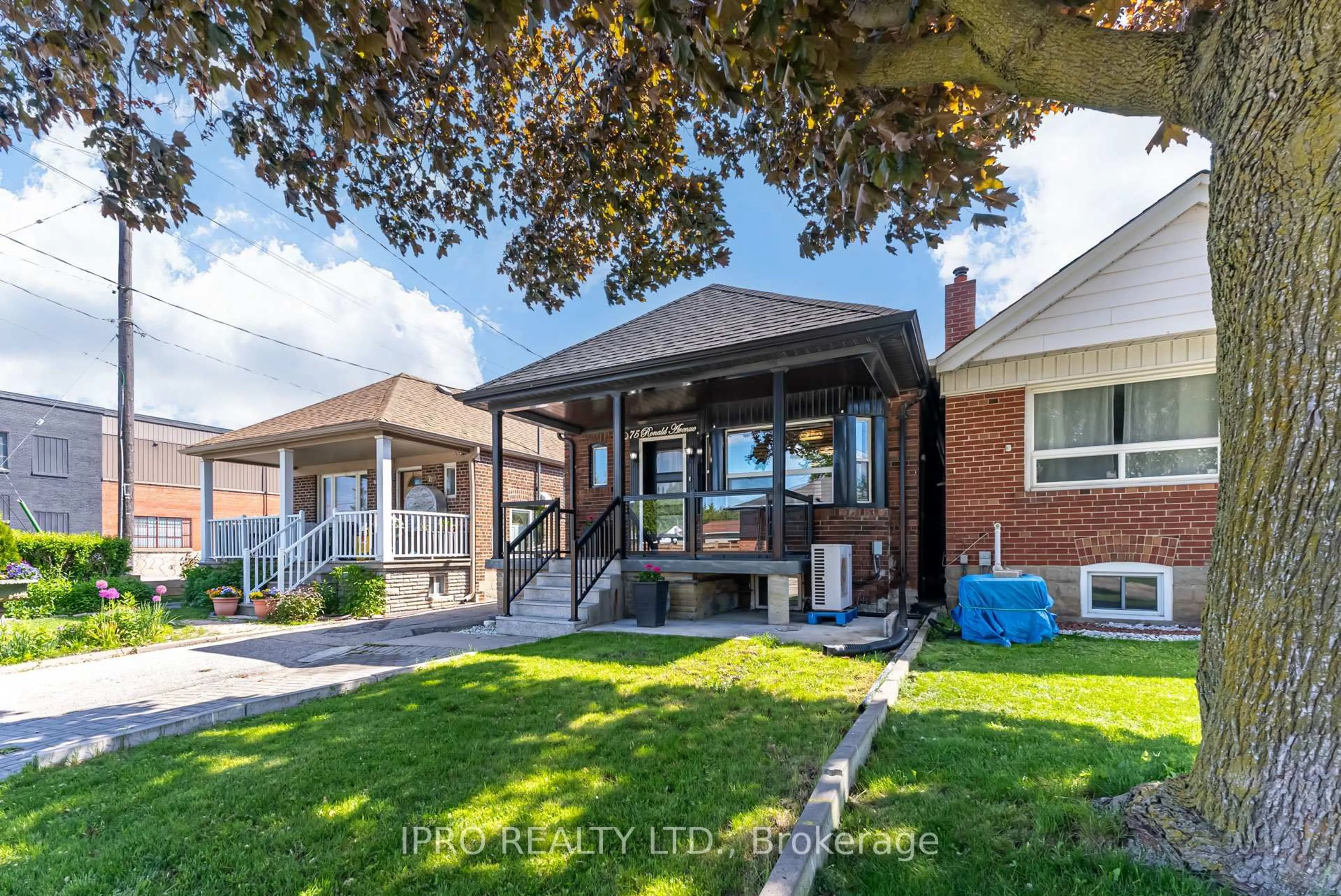 Home with brick exterior material, street for 75 Ronald Ave, Toronto Ontario M6E 4M8