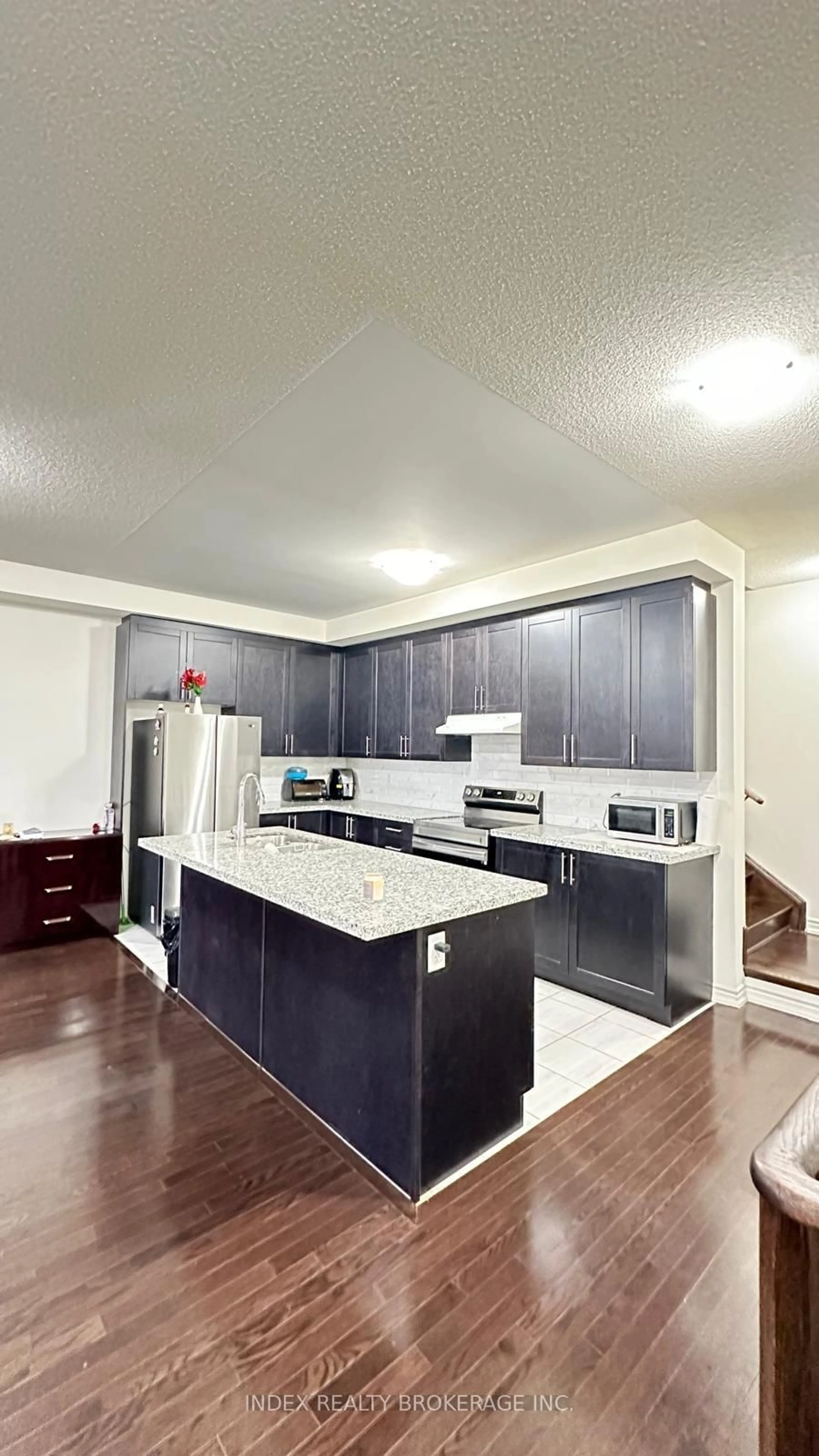 Open concept kitchen, wood/laminate floor for 56 Donald Fitch Cres, Brampton Ontario L7A 0B7