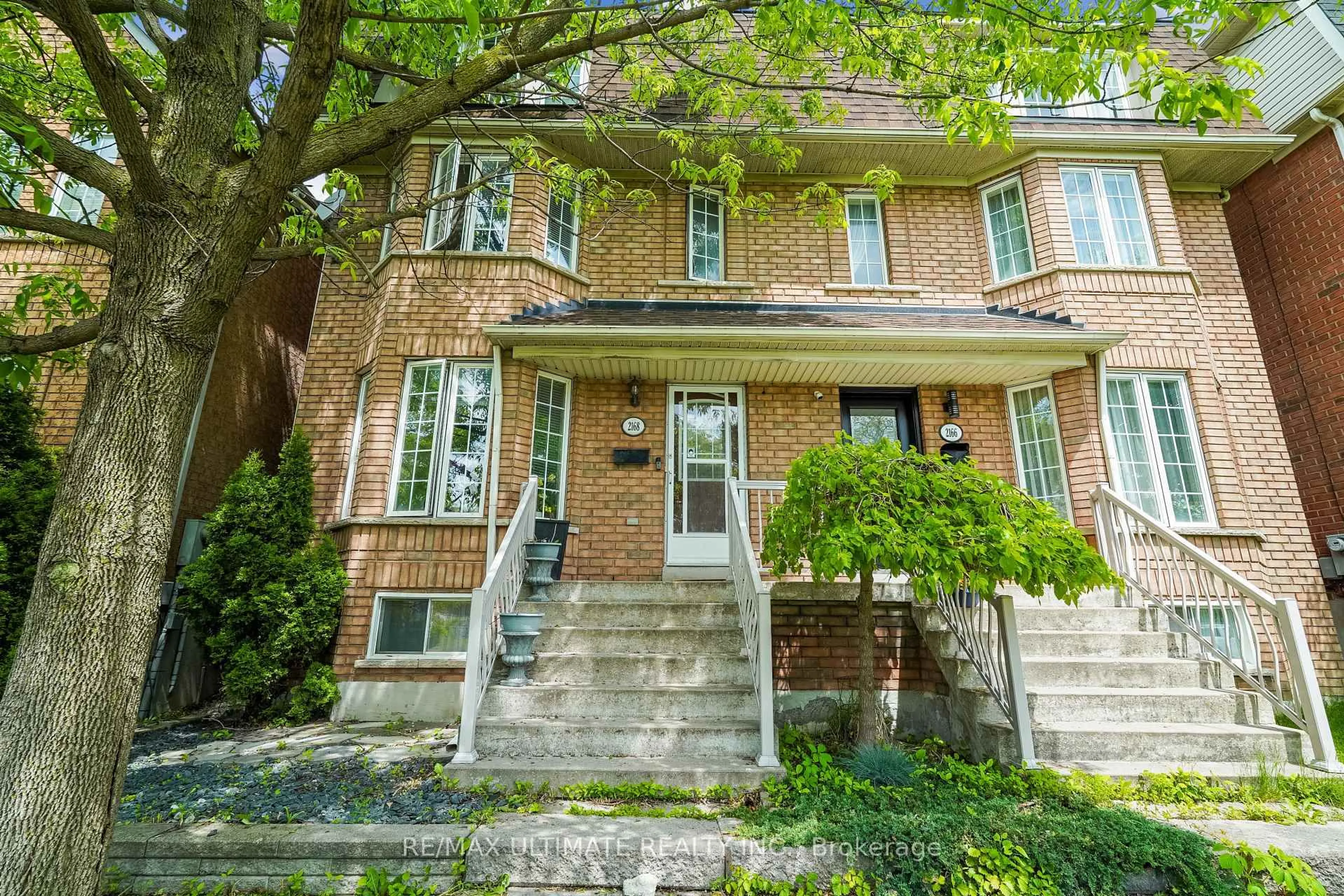 Home with brick exterior material, street for 2168 St. Clair Ave, Toronto Ontario M6N 5C1