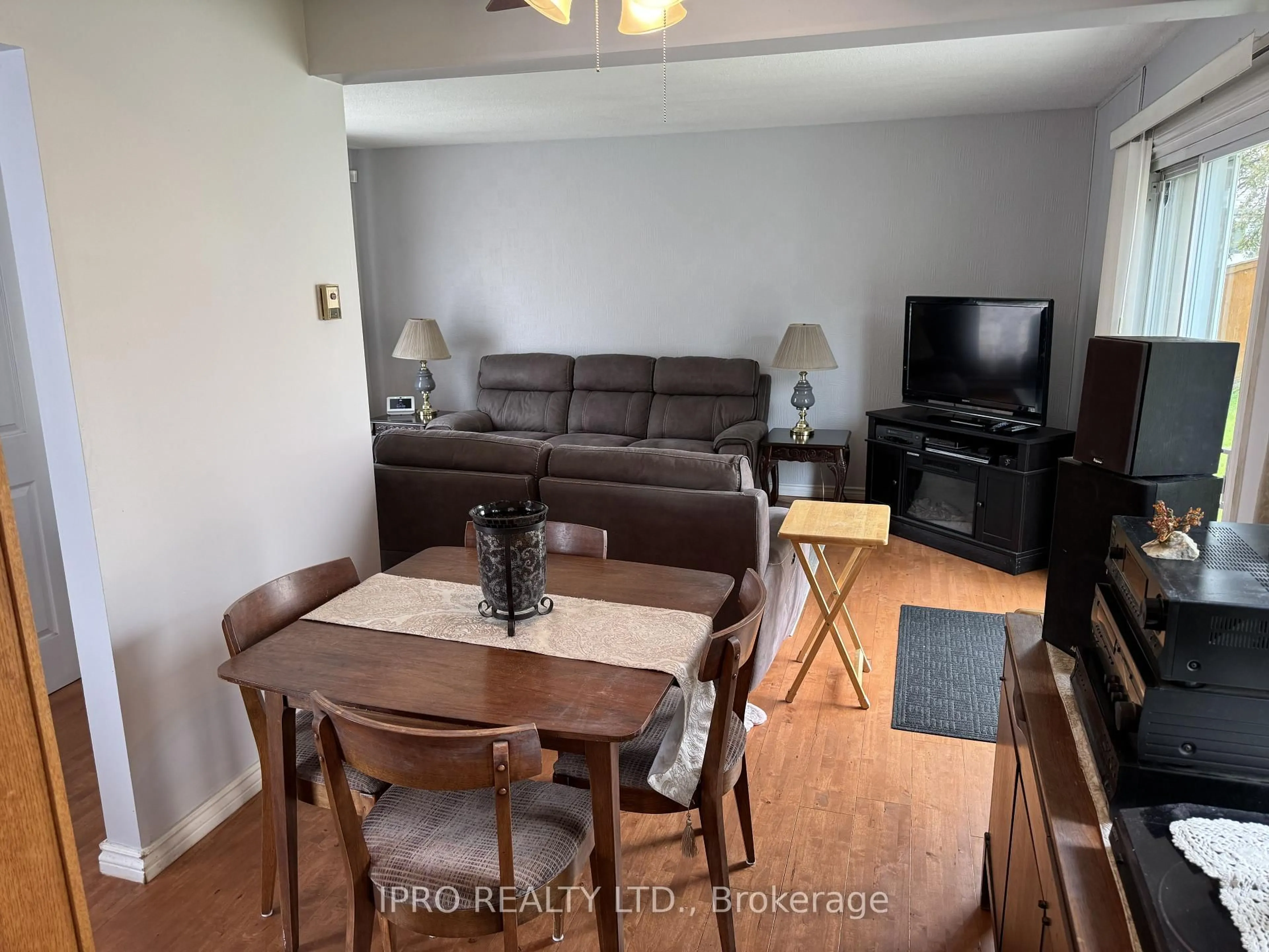 Living room with furniture, wood/laminate floor for 4 Hardcastle Crt, Brampton Ontario L6S 2A9