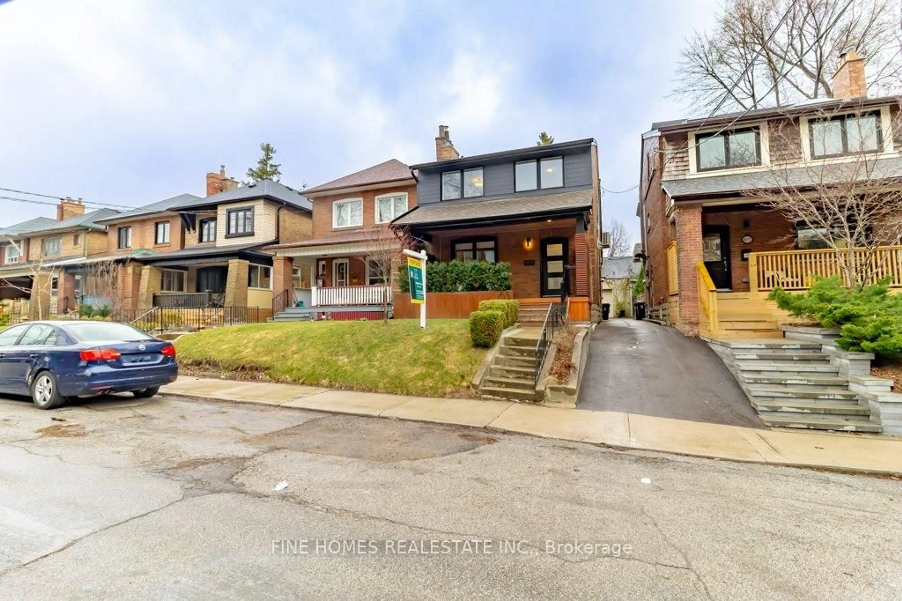 Home with brick exterior material, street for 65 Parkdale Rd, Toronto Ontario M6R 1E3