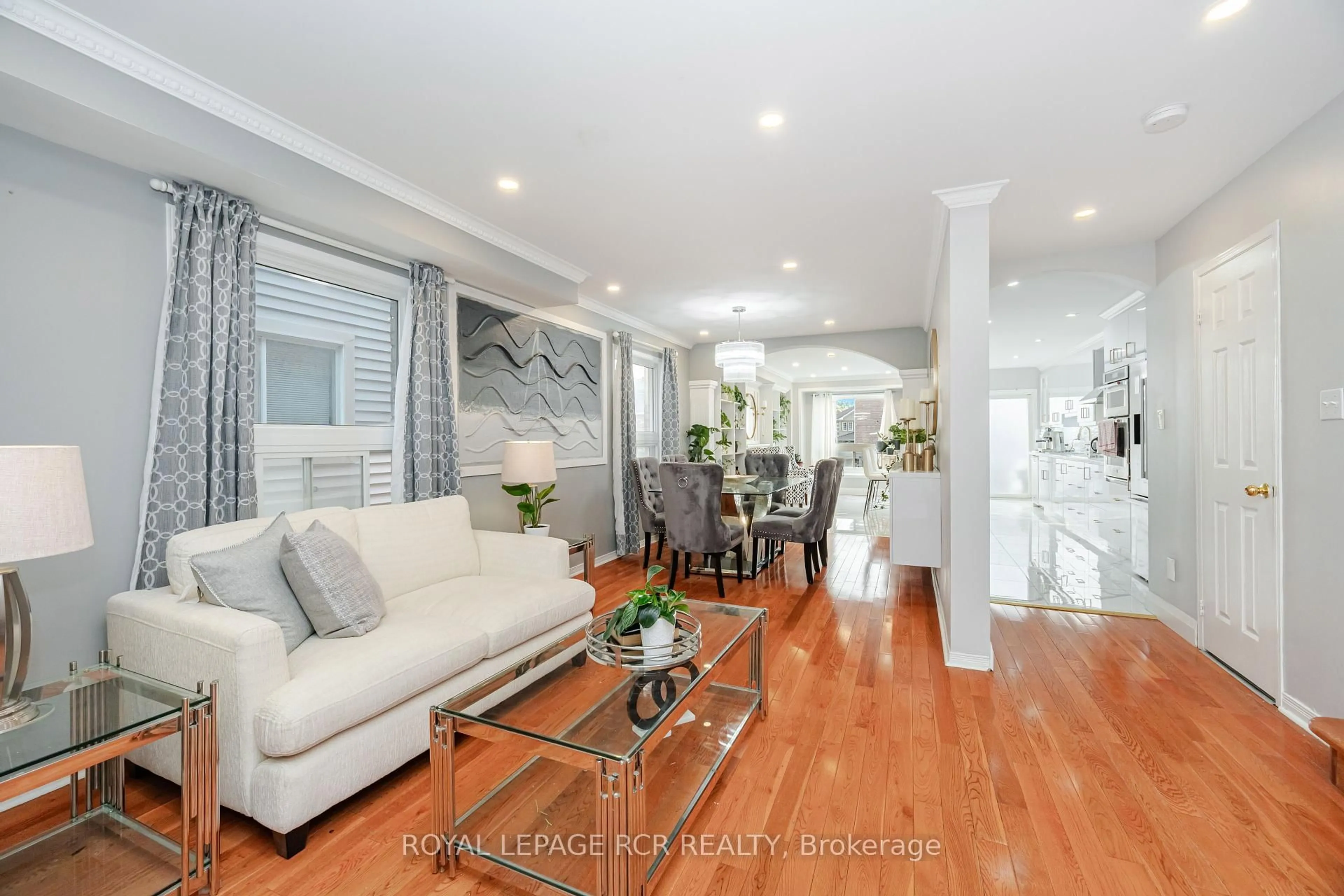 Living room with furniture, wood/laminate floor for 127 Tiller Tr, Brampton Ontario L6X 4S9