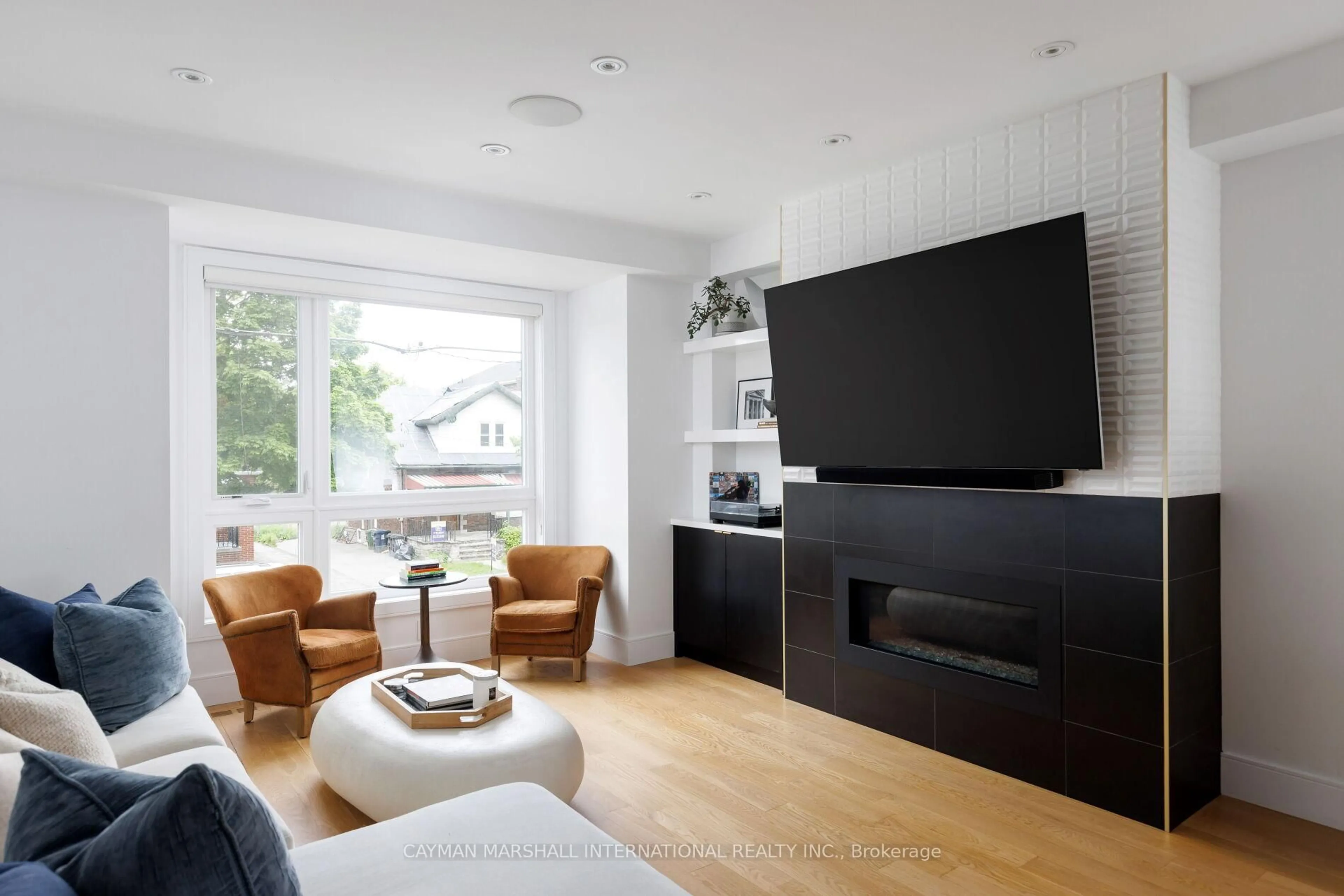 Living room with furniture, wood/laminate floor for 106 Ninth St, Toronto Ontario M8V 3E4