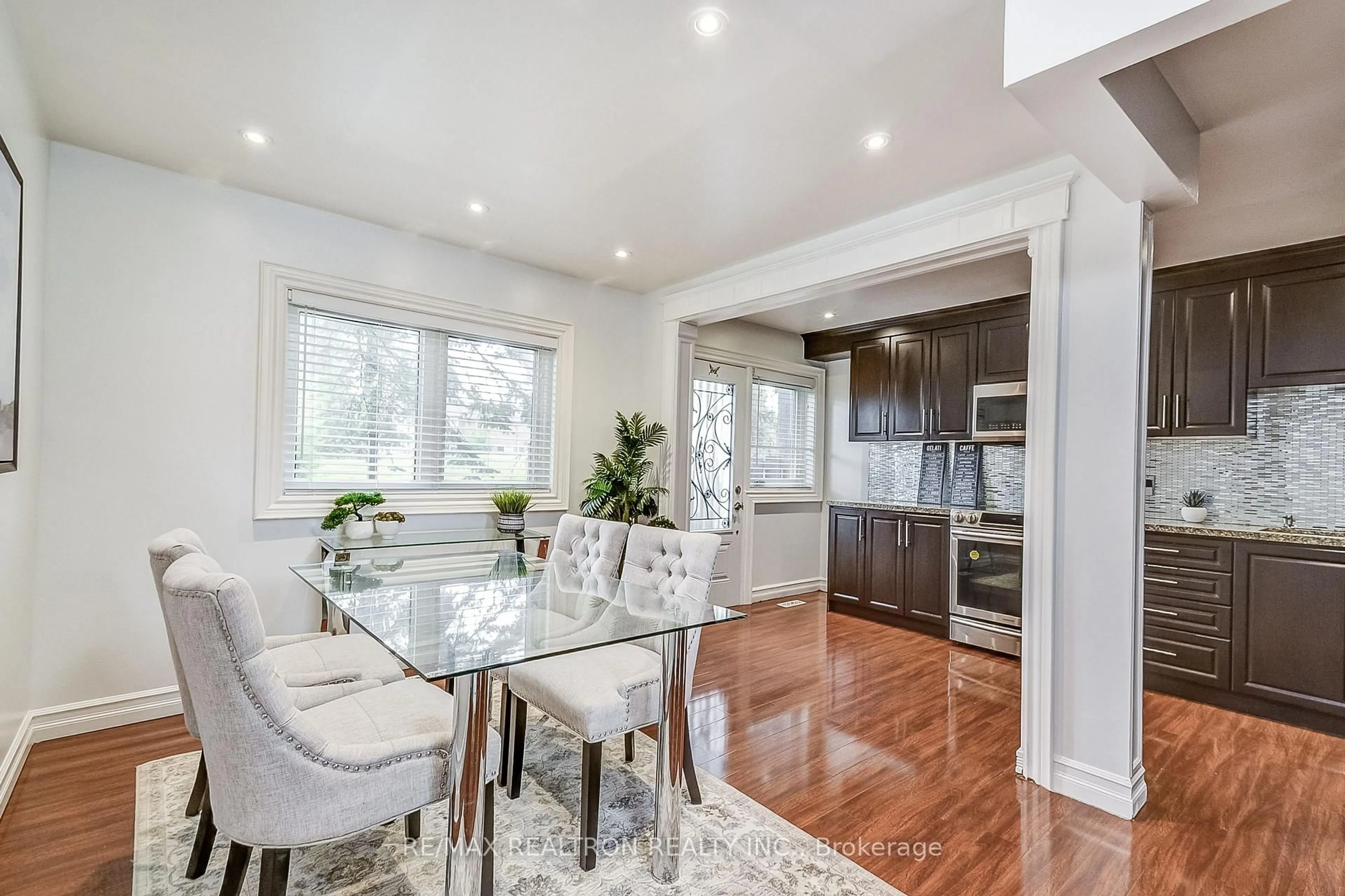 Open concept kitchen, wood/laminate floor for 6442 Finch Ave #212, Toronto Ontario M9V 1T4