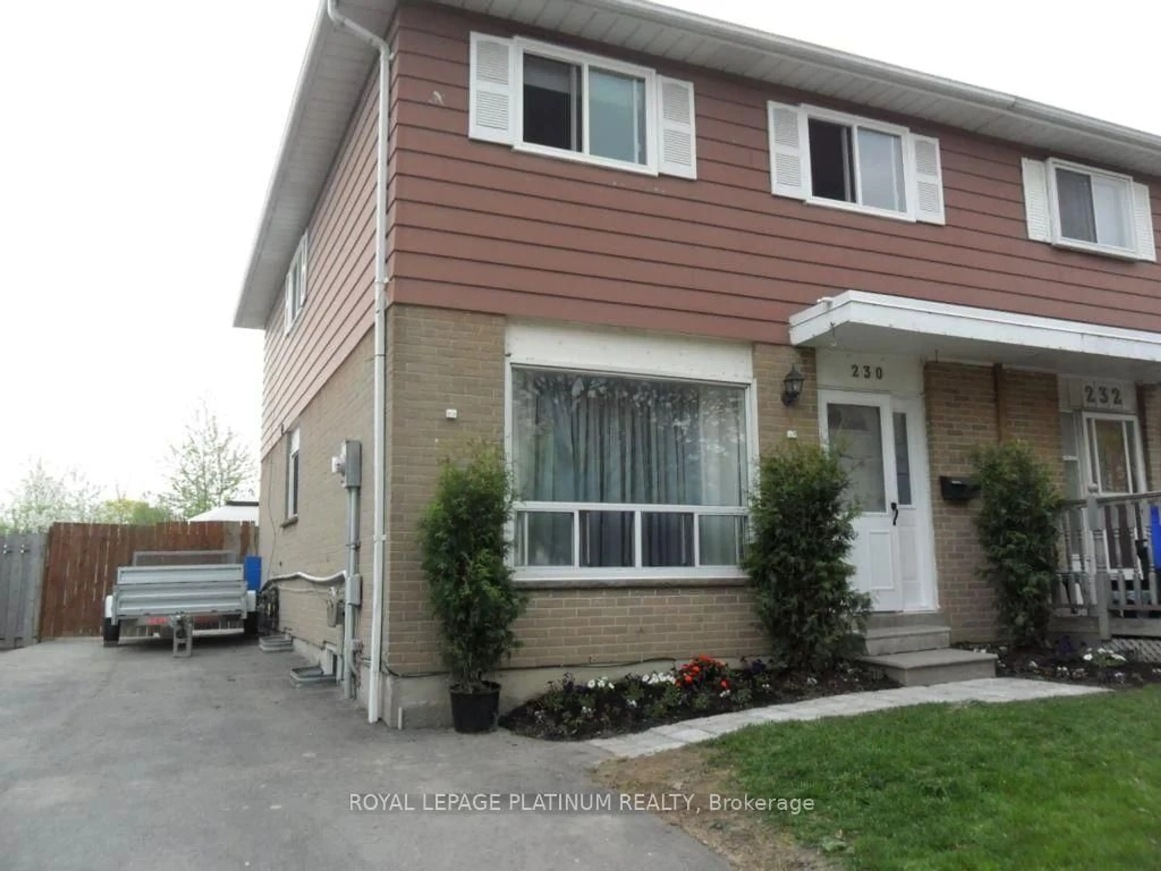 Home with vinyl exterior material, street for 230 Archdekin Dr, Brampton Ontario L6V 1Z2