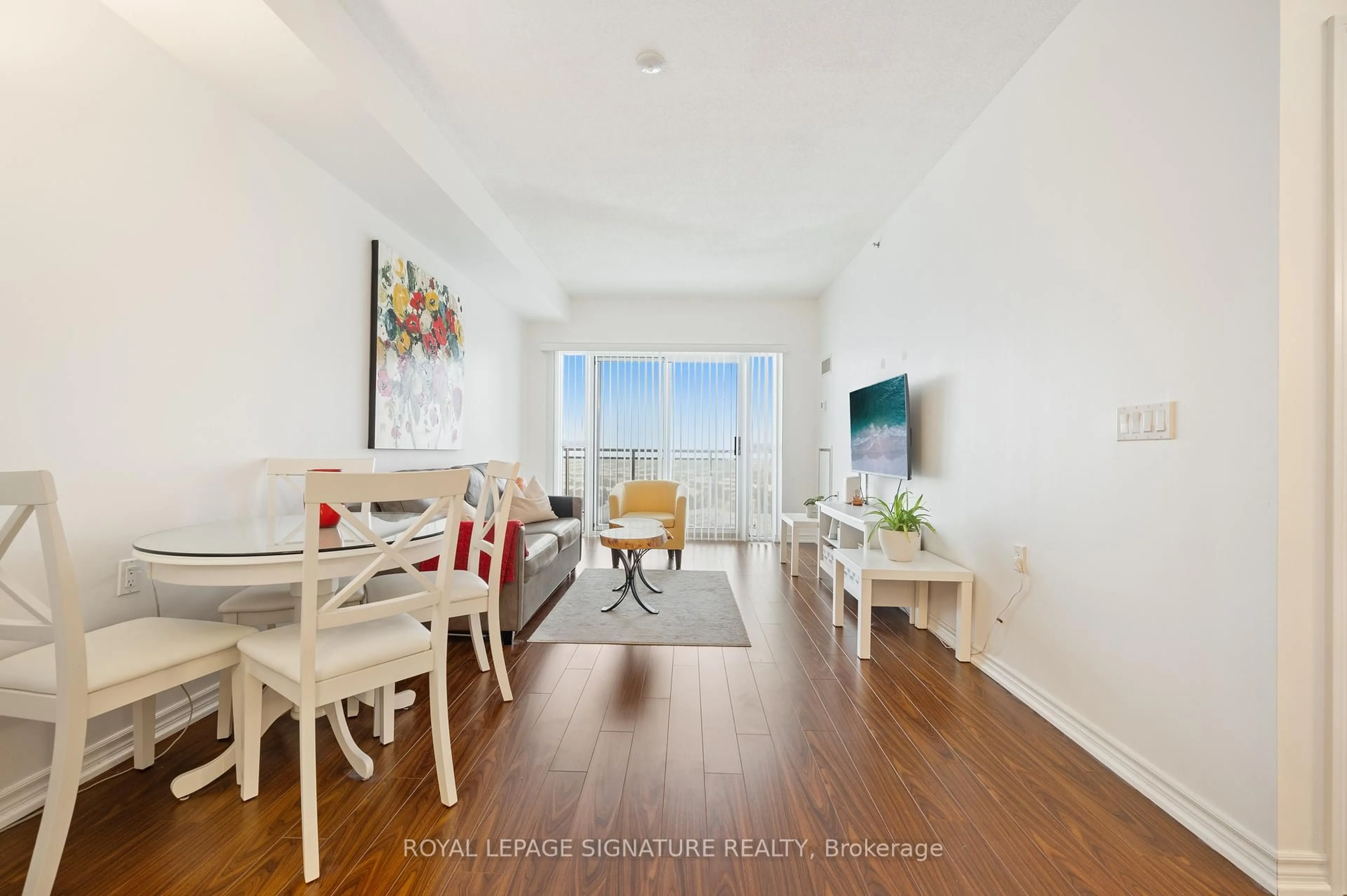 Living room with furniture, wood/laminate floor for 810 Scollard Crt #1003, Mississauga Ontario L5V 0A7