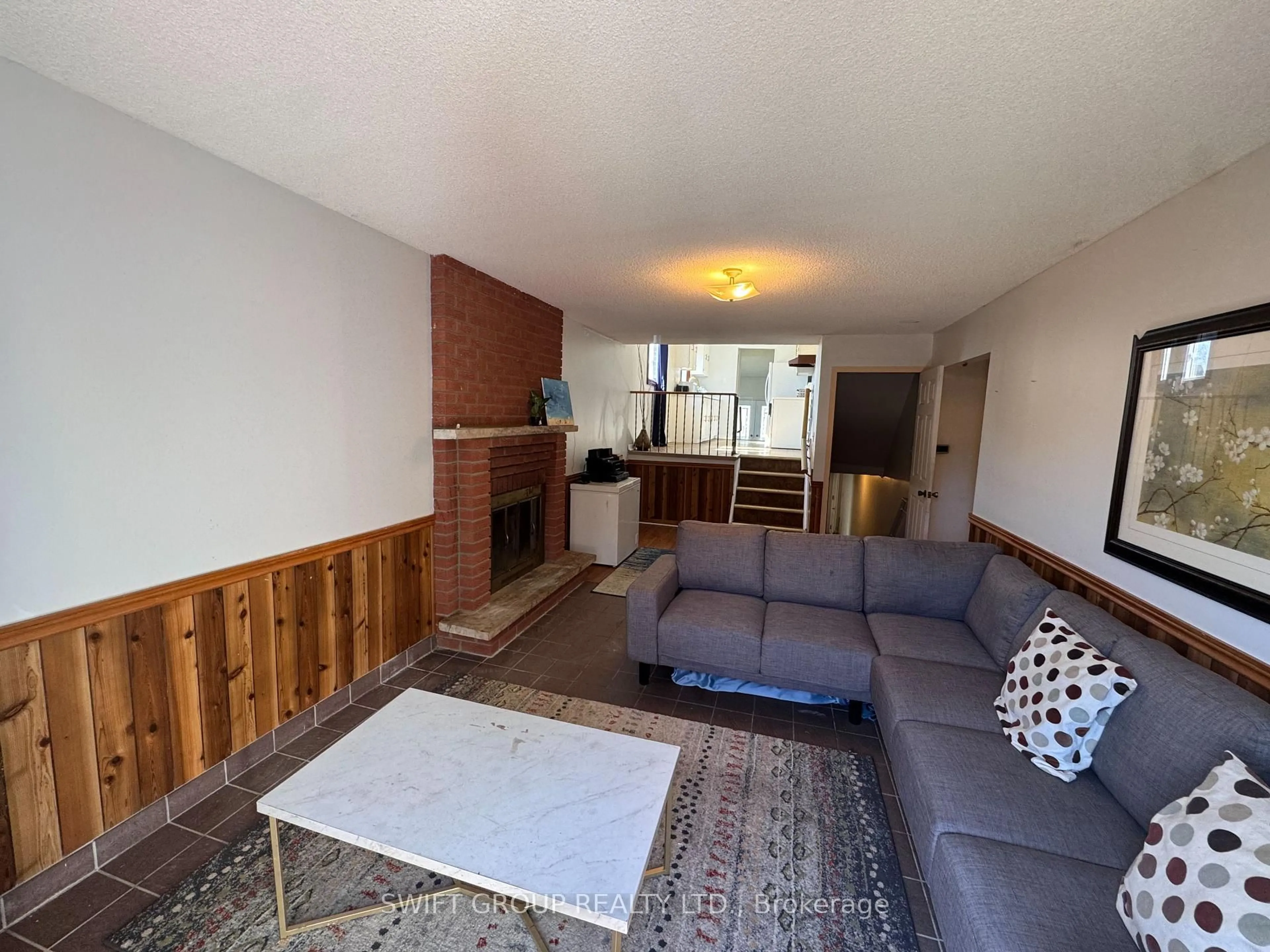 Living room with furniture, unknown for 36 Mount Pleasant Dr, Brampton Ontario L6Z 1K2