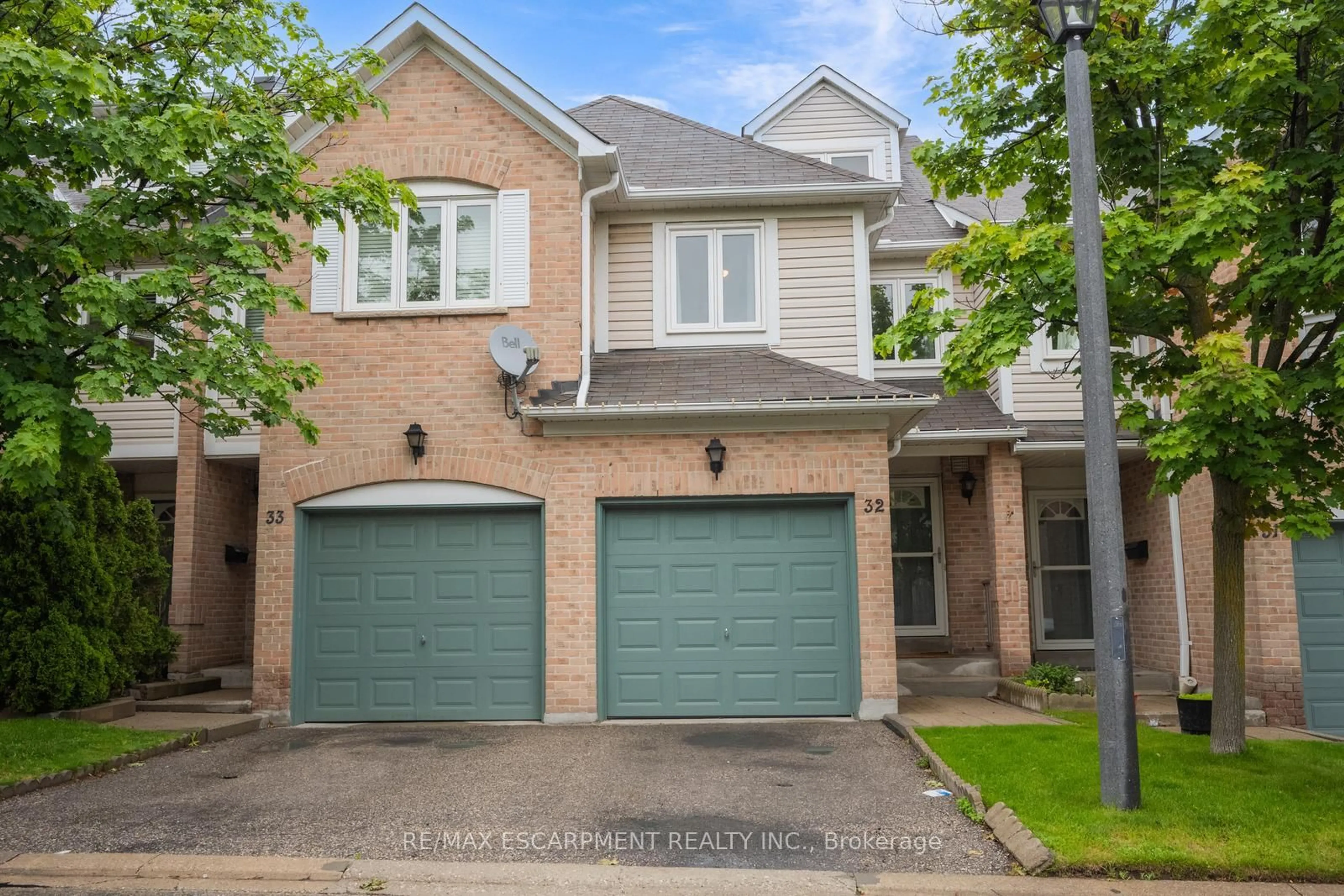Home with brick exterior material, street for 55 Barondale Dr #32, Mississauga Ontario L4Z 3P9
