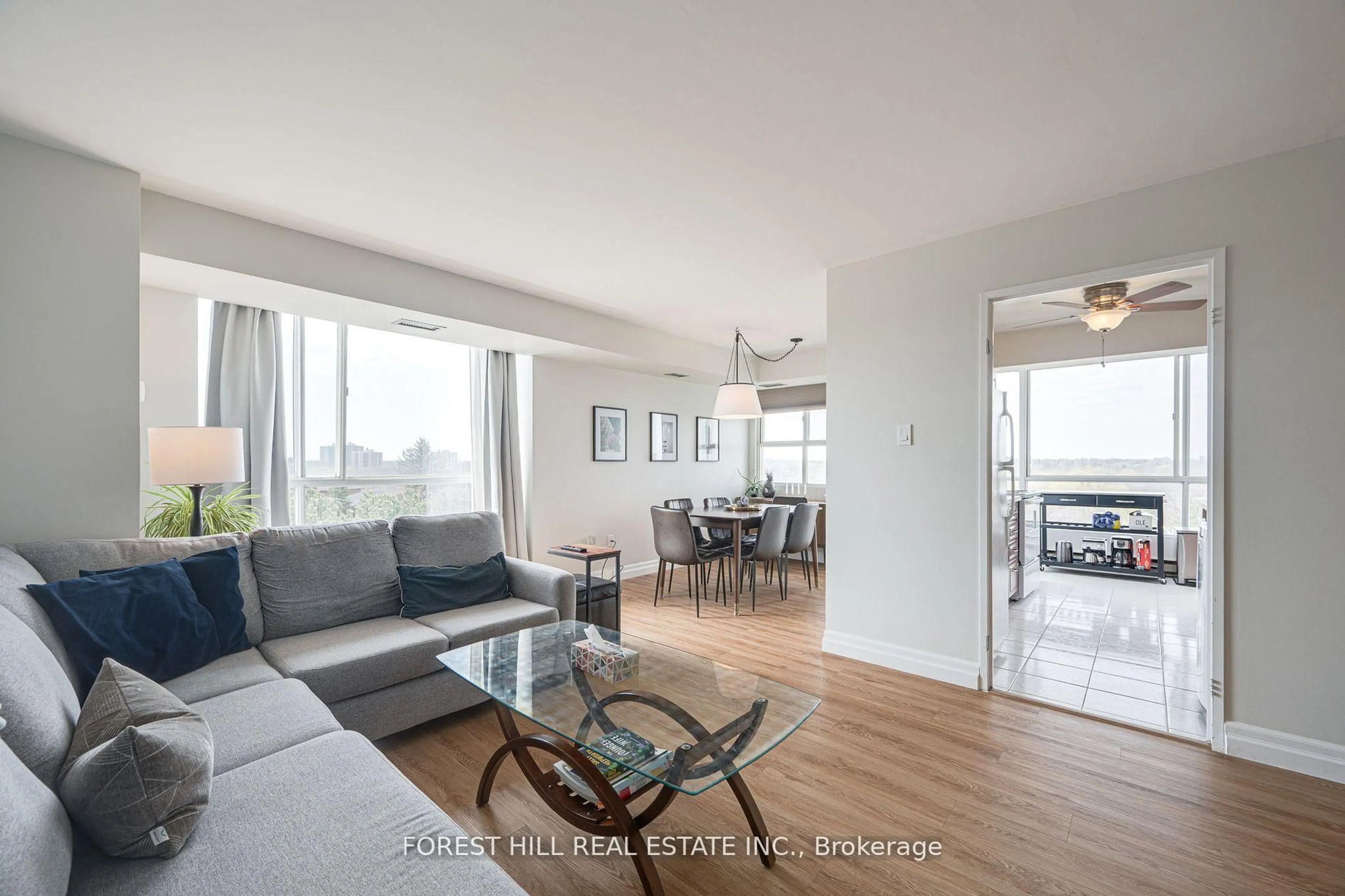 Living room with furniture, wood/laminate floor for 3077 Weston Rd #609, Toronto Ontario M9M 3A1
