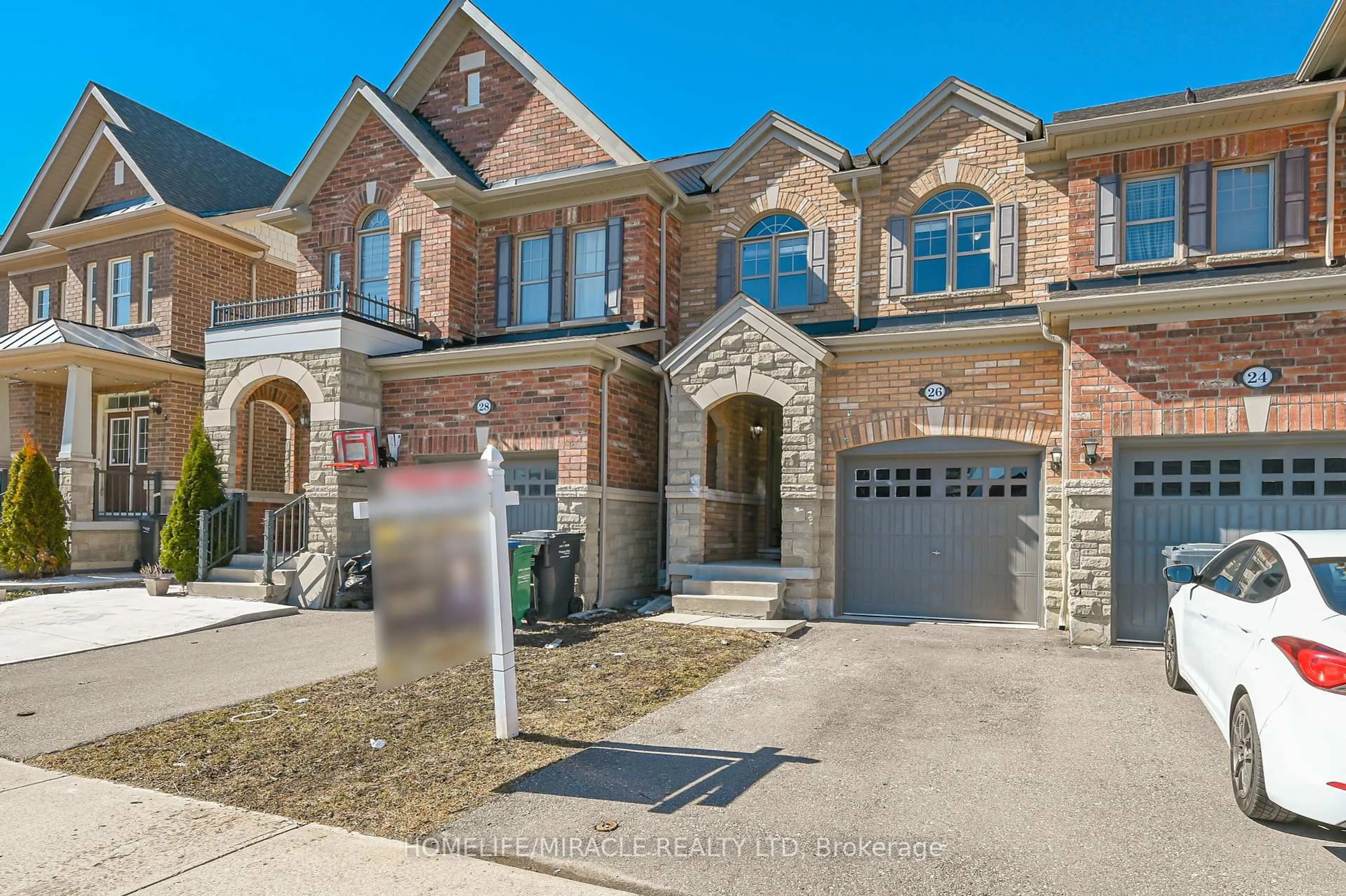 Home with brick exterior material, street for 26 Hogan Manor Dr, Brampton Ontario L7A 4V3