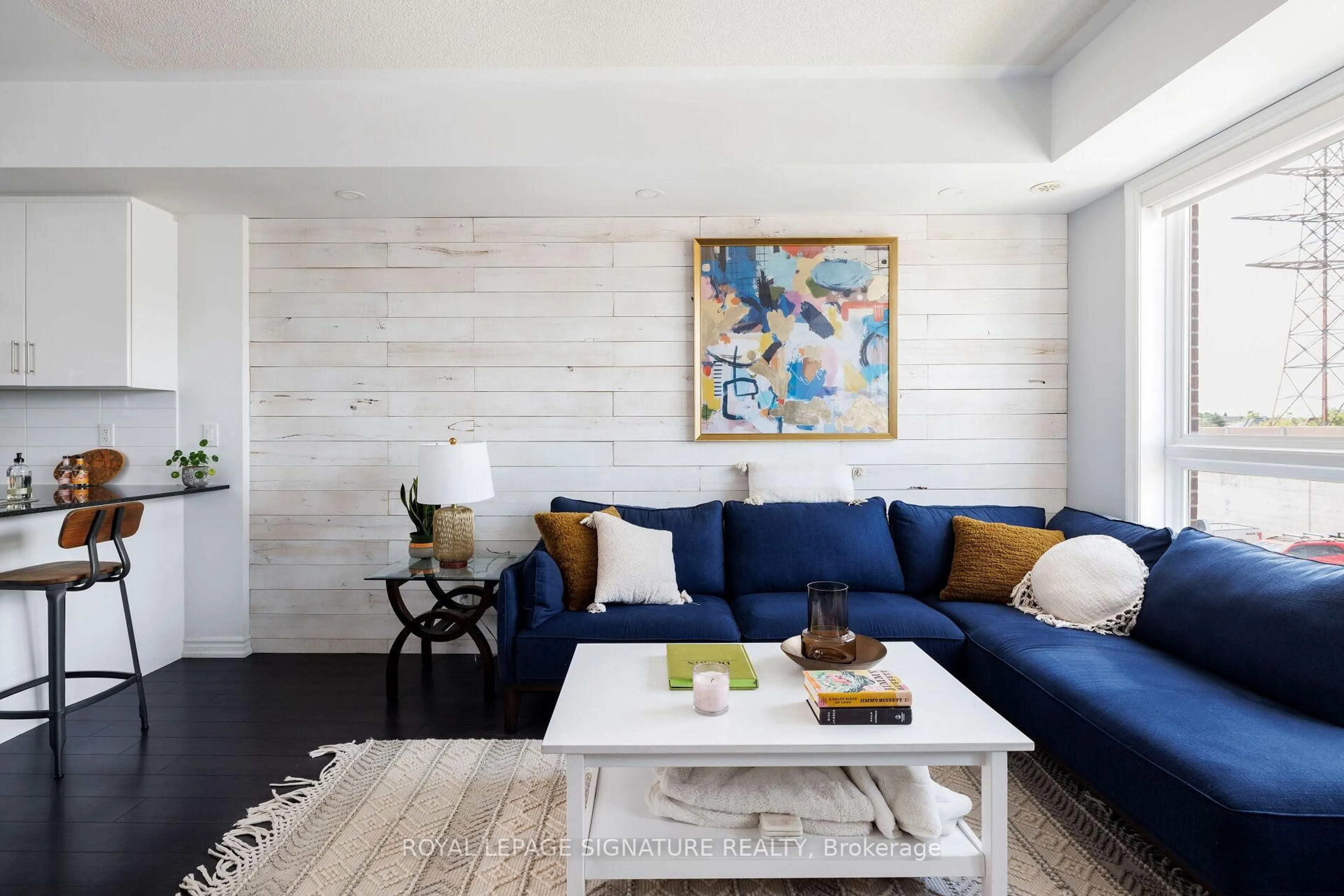 Living room with furniture, wood/laminate floor for 110 Caledonia Park Rd #1, Toronto Ontario M6H 0B2