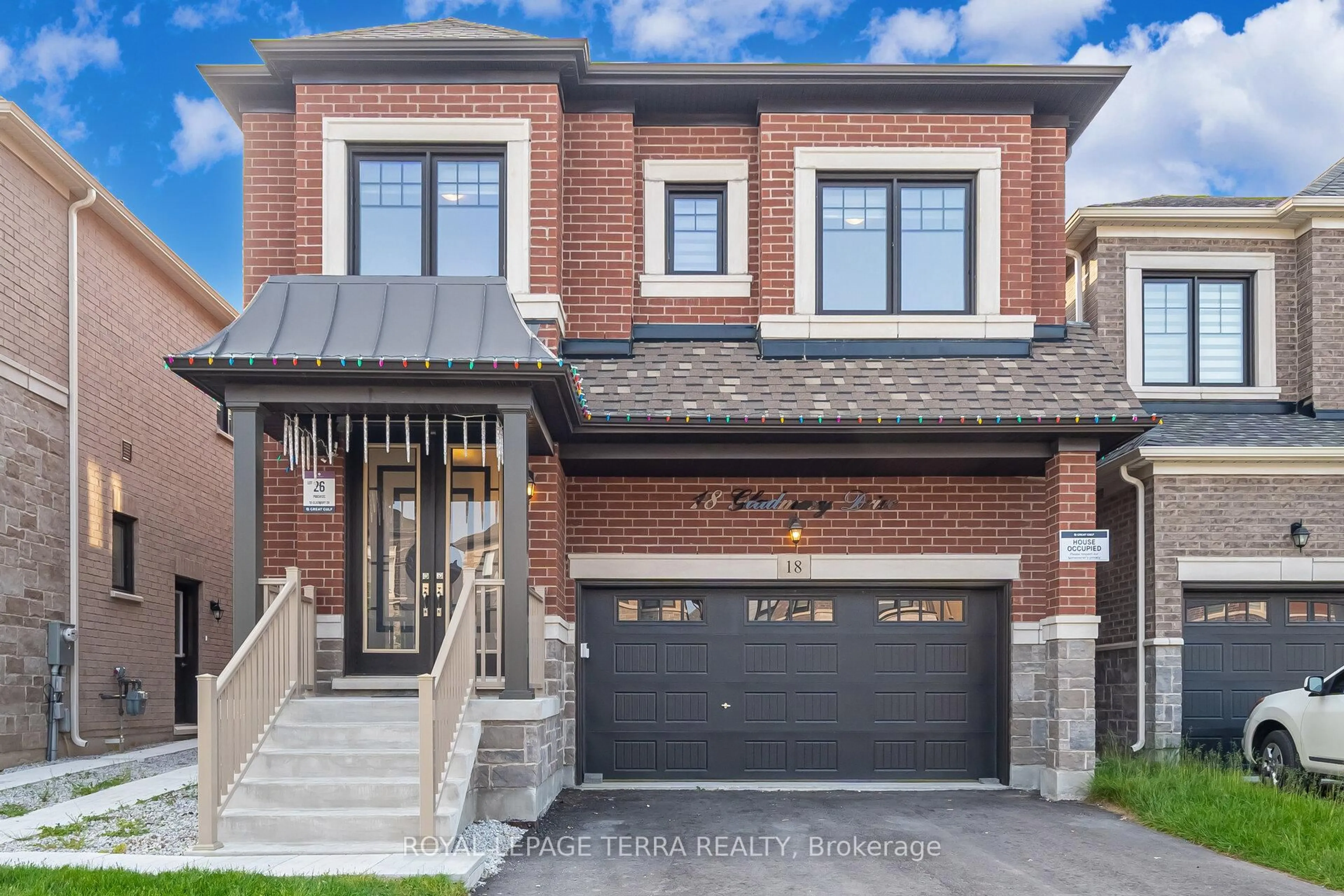 Home with brick exterior material, street for 18 Gladmary Dr, Brampton Ontario L6Y 0E4