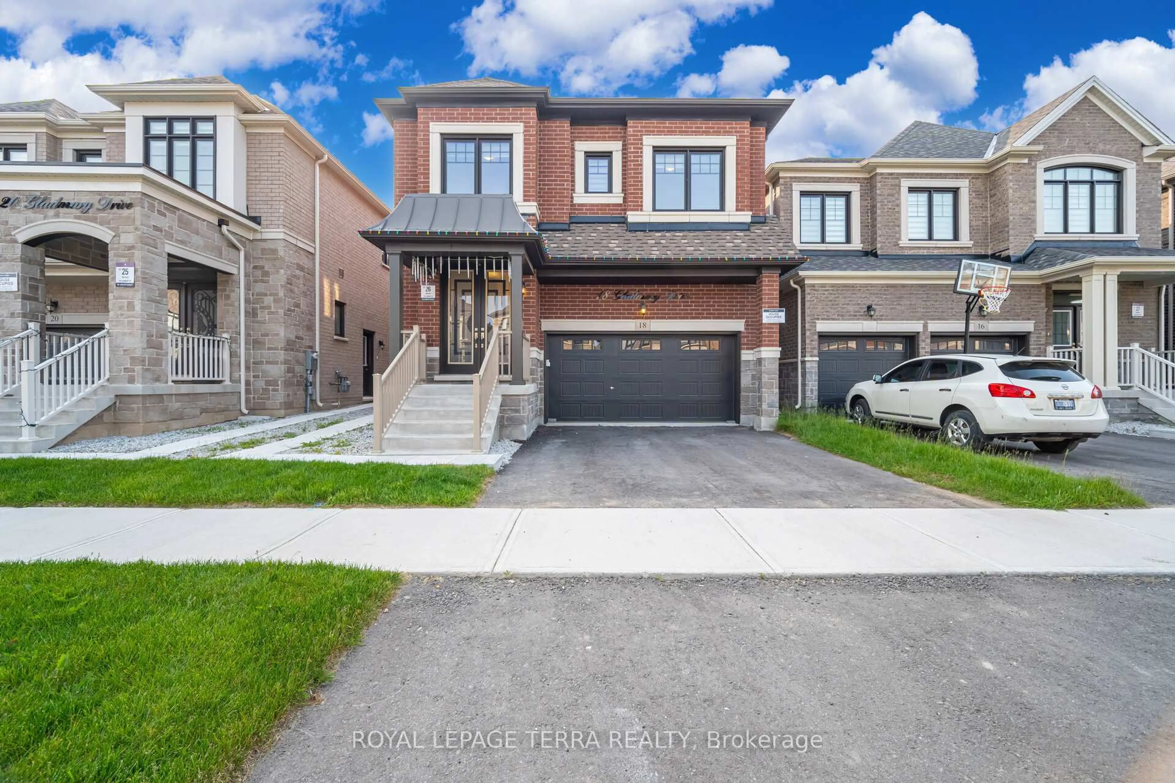 Home with brick exterior material, street for 18 Gladmary Dr, Brampton Ontario L6Y 0E4
