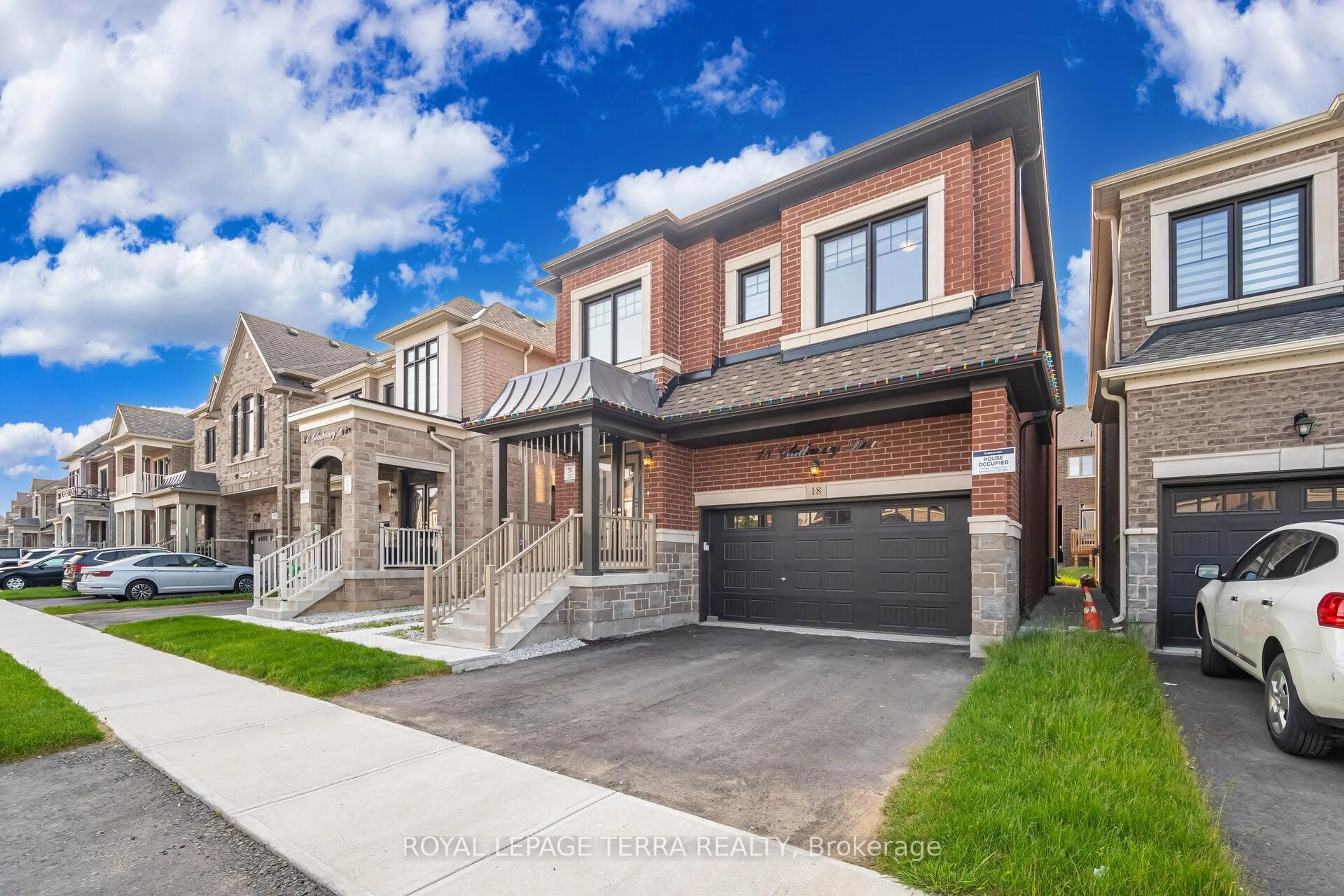 Home with brick exterior material, street for 18 Gladmary Dr, Brampton Ontario L6Y 0E4