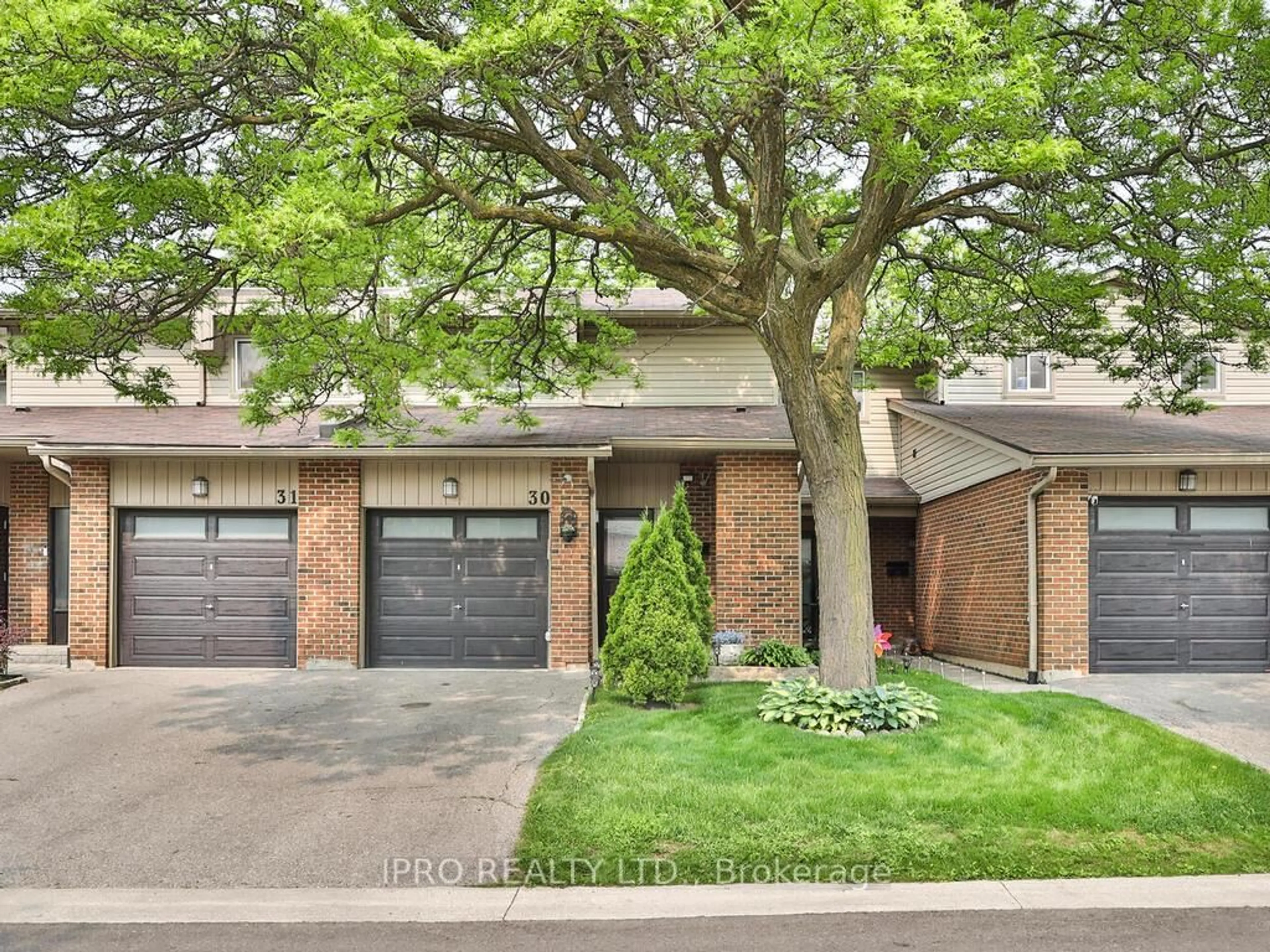 Home with brick exterior material, street for 485 Meadows Blvd #30, Mississauga Ontario L4Z 1H1