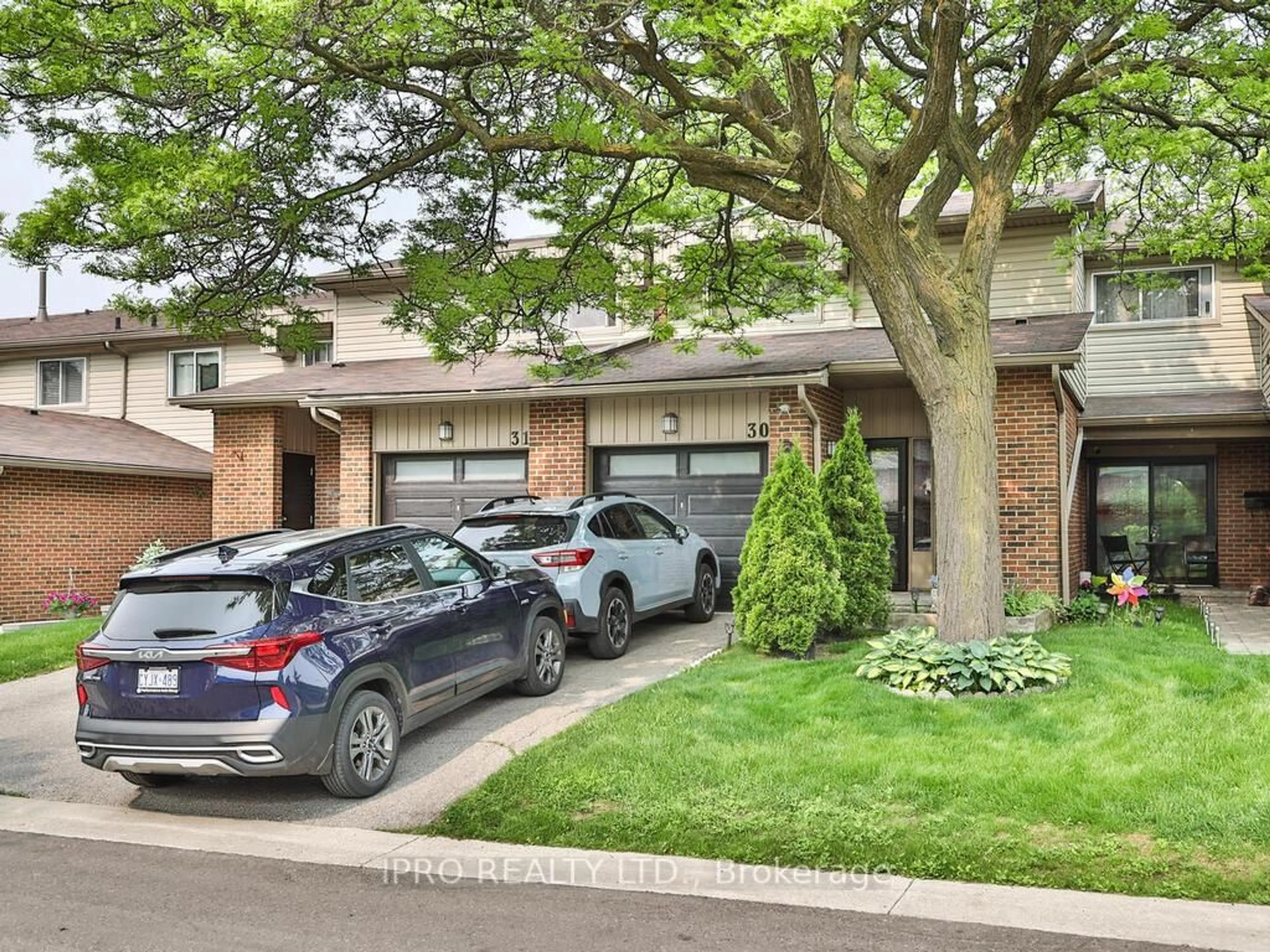Home with brick exterior material, street for 485 Meadows Blvd #30, Mississauga Ontario L4Z 1H1